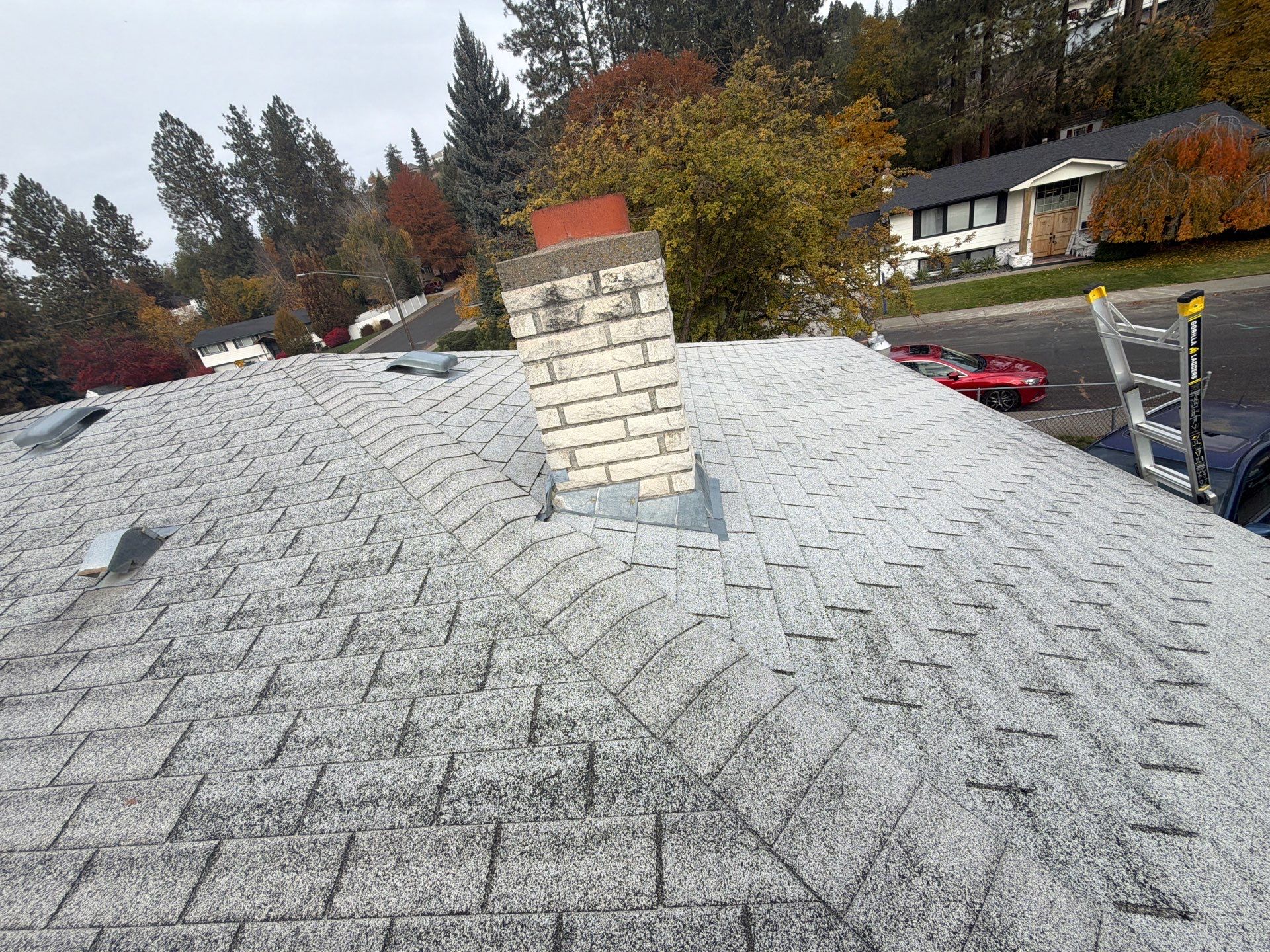 Residential Asphalt Shingle Roof Replacement and Skylight Installation in Spokane by Alpine Roofing