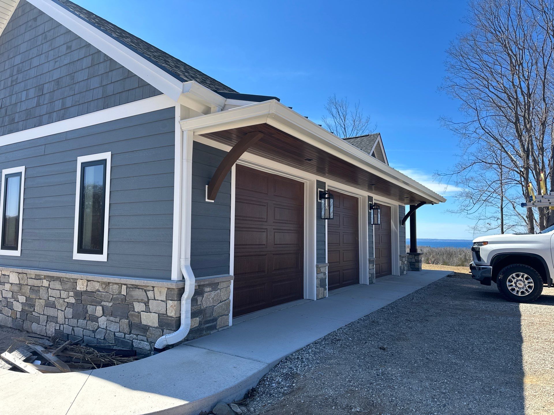 Residential Gutter and Downspout Installation for Ellsworth Home Exterior by Rainbow Seamless Systems