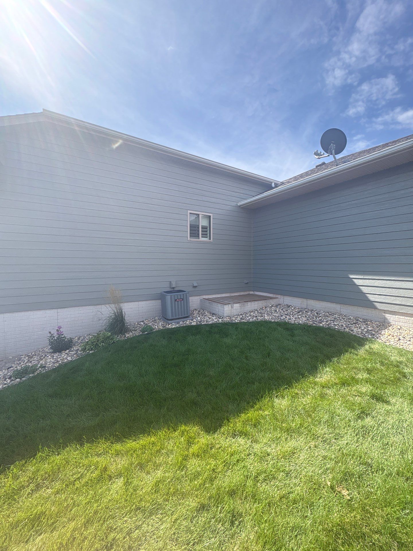 Full Exterior Home Painting on Blue Lap Siding in Sioux Falls by Select Painting, Coatings & Garage Cabinets