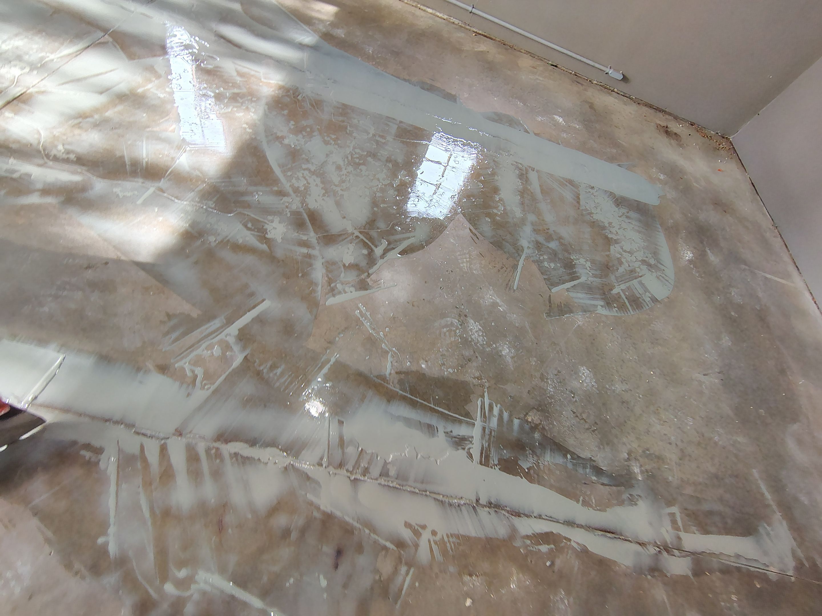 Garage Floor Concrete Coating and Crack Repair in Sioux Falls by Select Painting, Coatings & Garage Cabinets