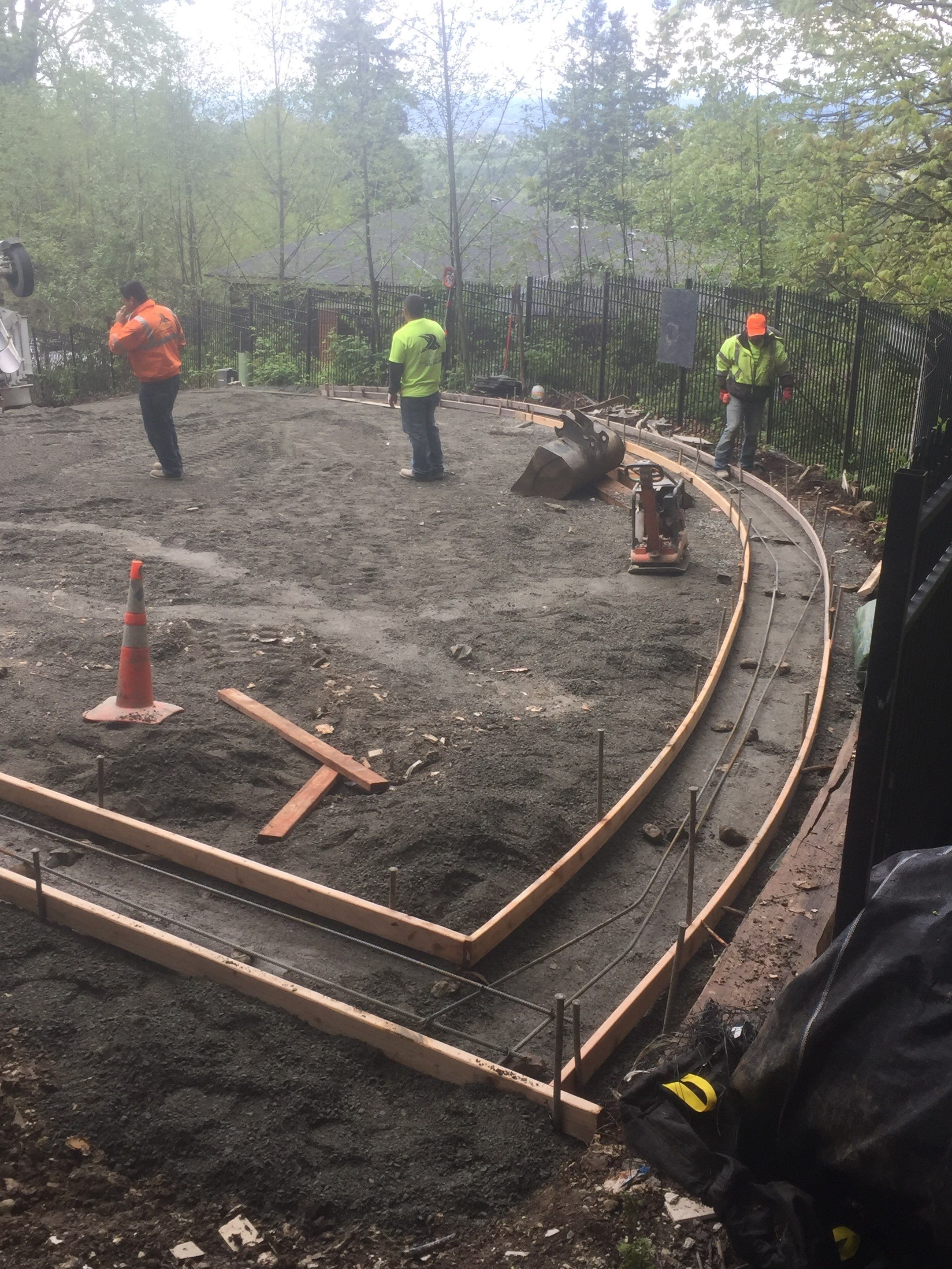 Asphalt Driveway and Stamped Concrete Patio Finish  by Jireh Asphalt & Concrete Inc 