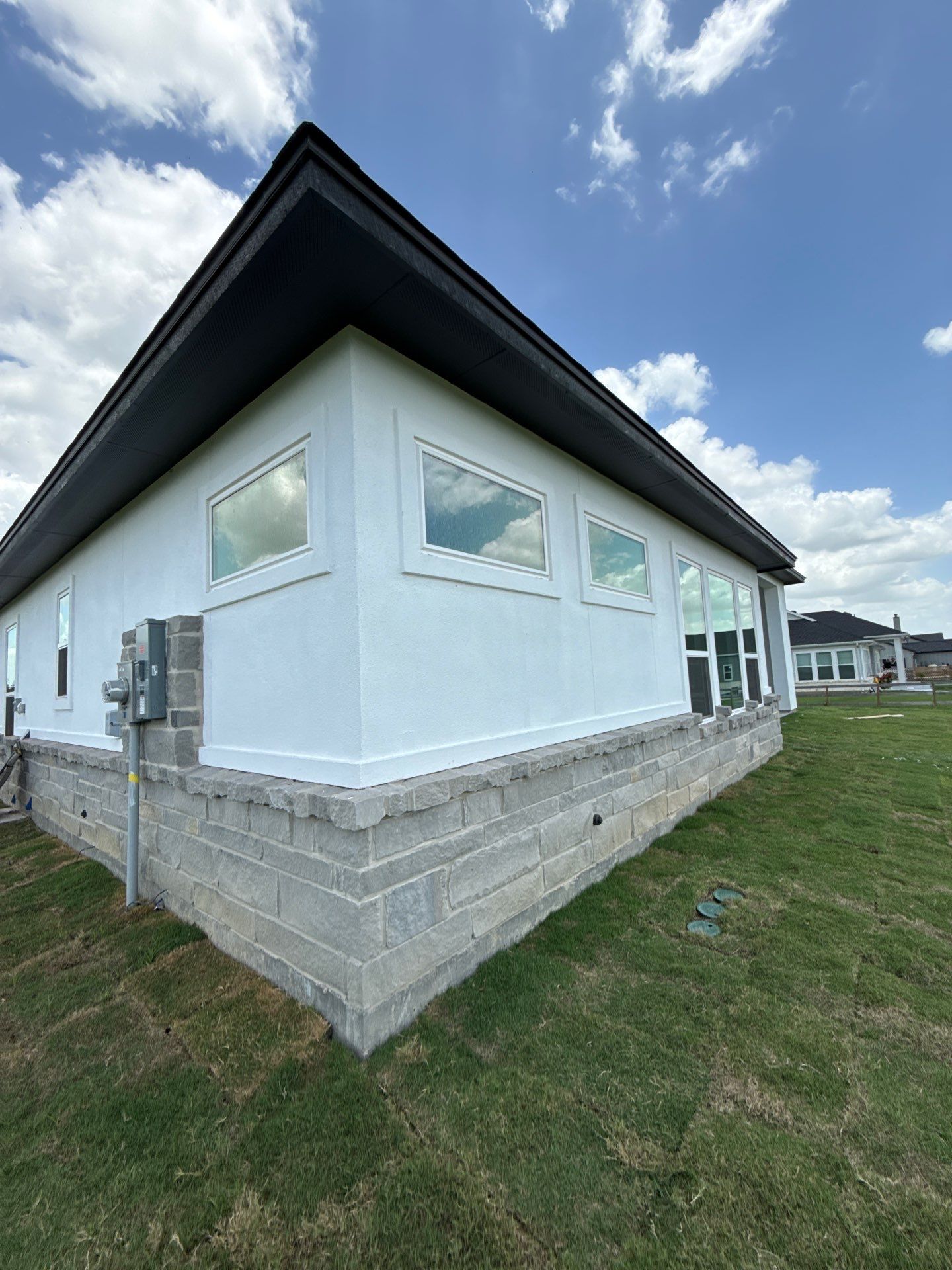 Waller Sophistication: Snowbound Color Stucco with Limestone Accents. by Apex Conventional Stucco Llc