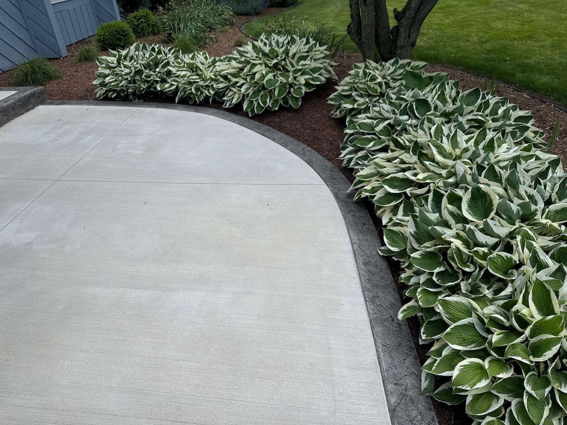 Charcoal Release Border with Broom Finish  by NG Masonry & Construction LLC