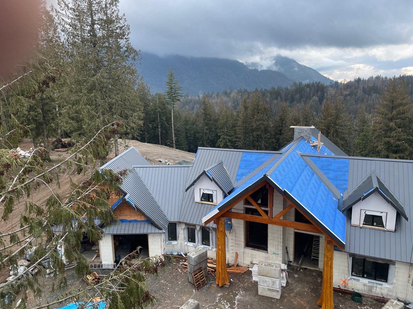 Residential Roofing Installation using 12" Prolok metal by Top Notch Roofing Inc