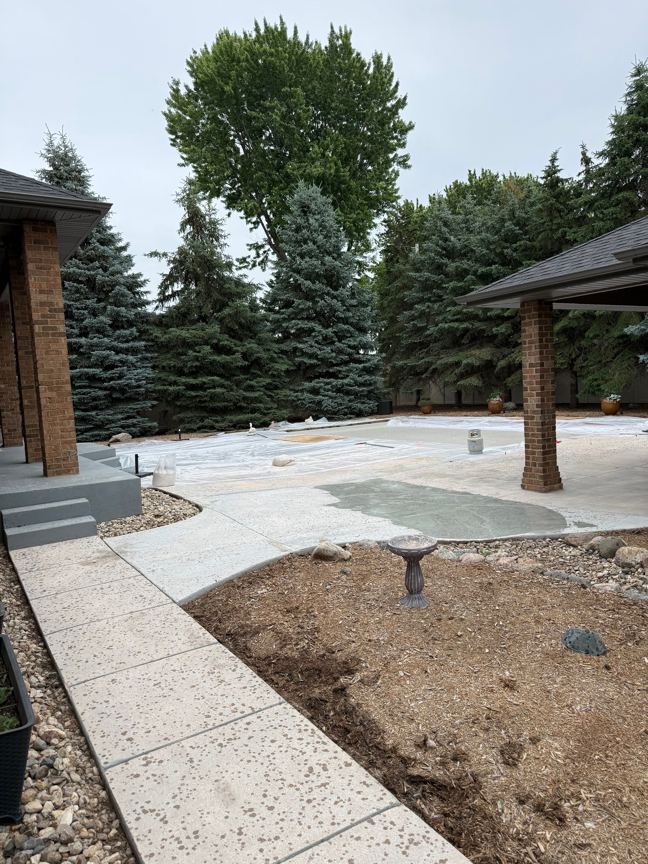 Decorative Concrete Pool Deck and Patio Resurfacing in Sioux Falls by Select Painting, Coatings & Garage Cabinets