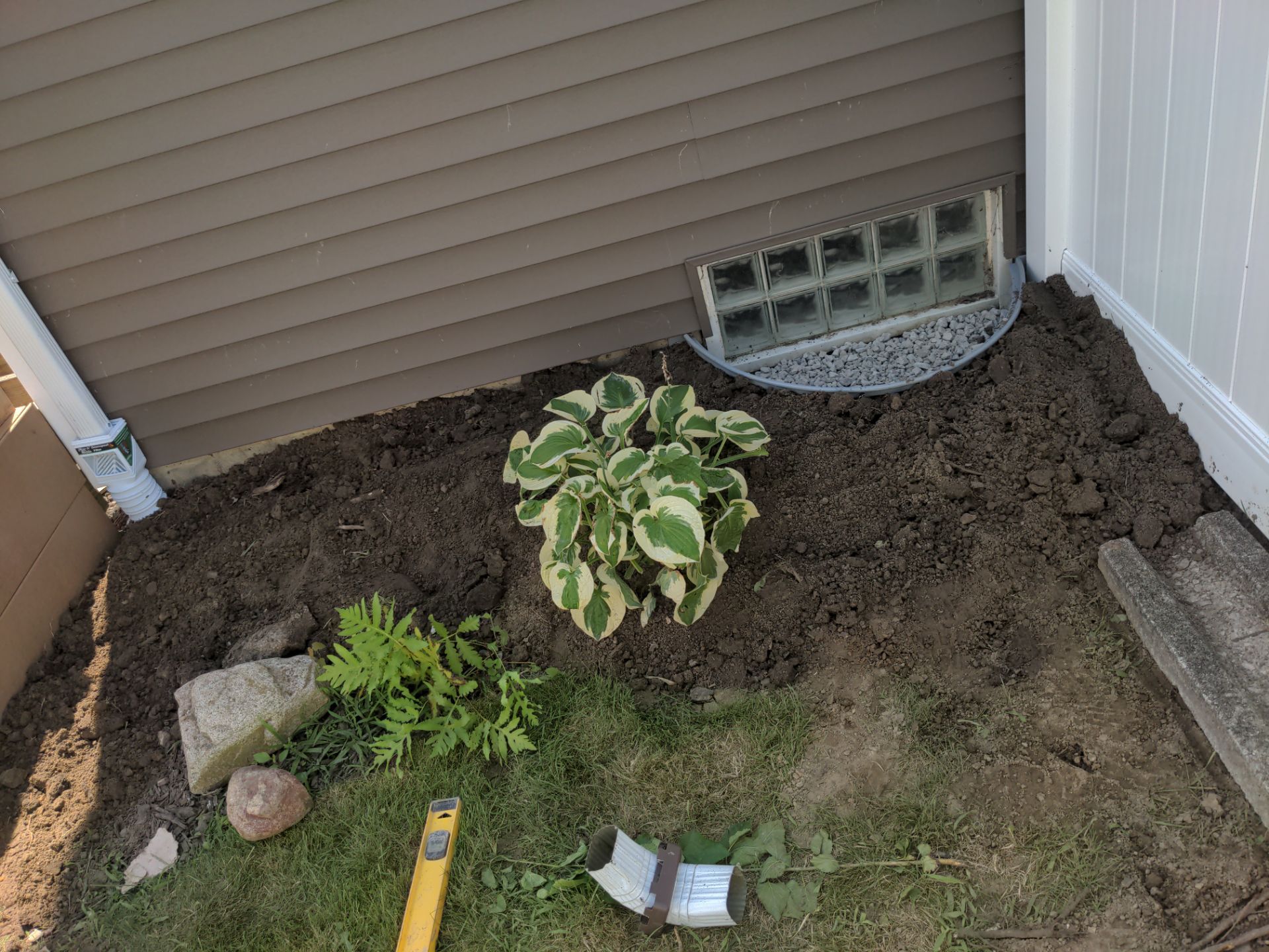 Interior Basement Waterproofing System and Egress Window Installation by Toledo Basement Repair 