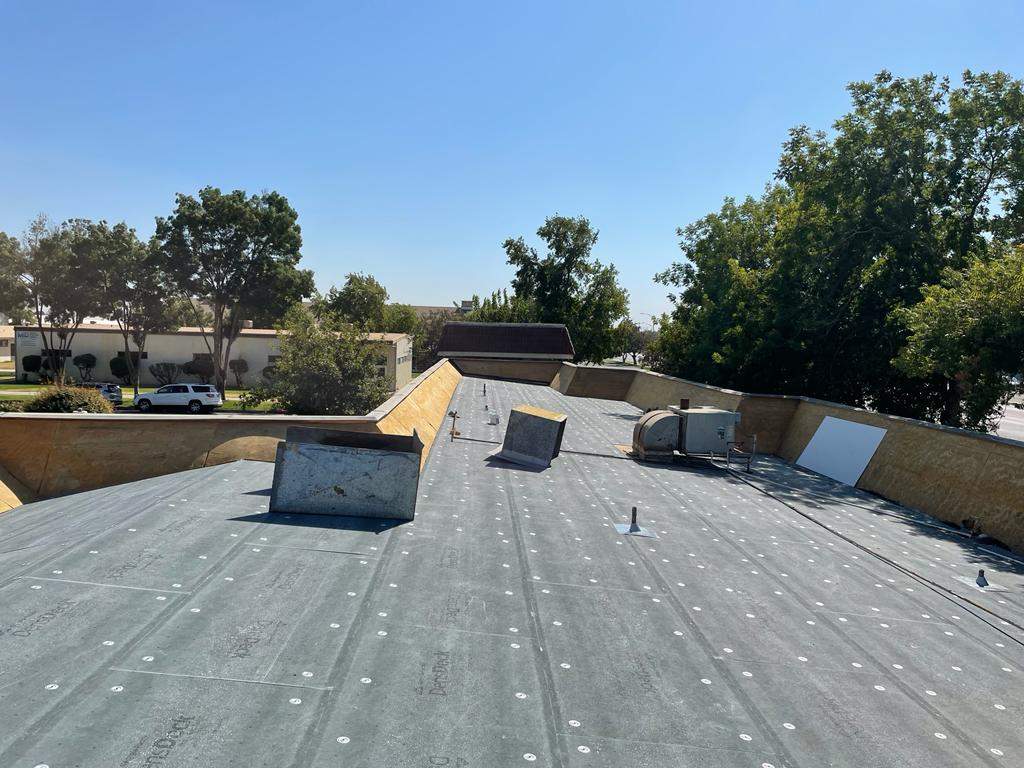 Commercial Roofing Installation using General Coatings acrylic coatings and spray foam by Straight Edge Roofing Inc