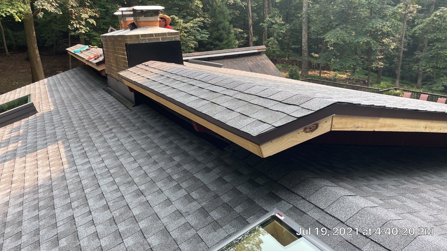 Deckhouse Roof Replacement by American Home Contractors