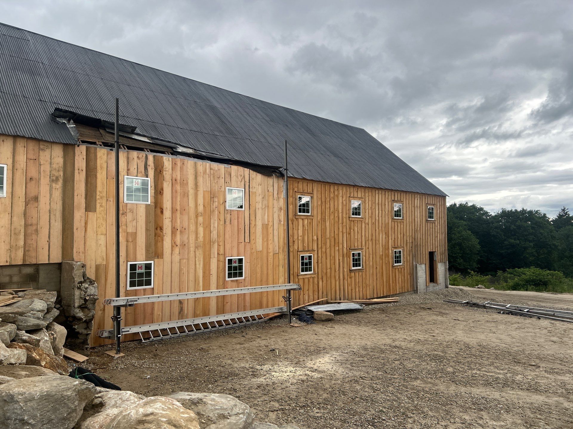Barn Restoration and Board-and-Batten Siding Installation in Hansons Ridge by B's Roofing & Construction LLC