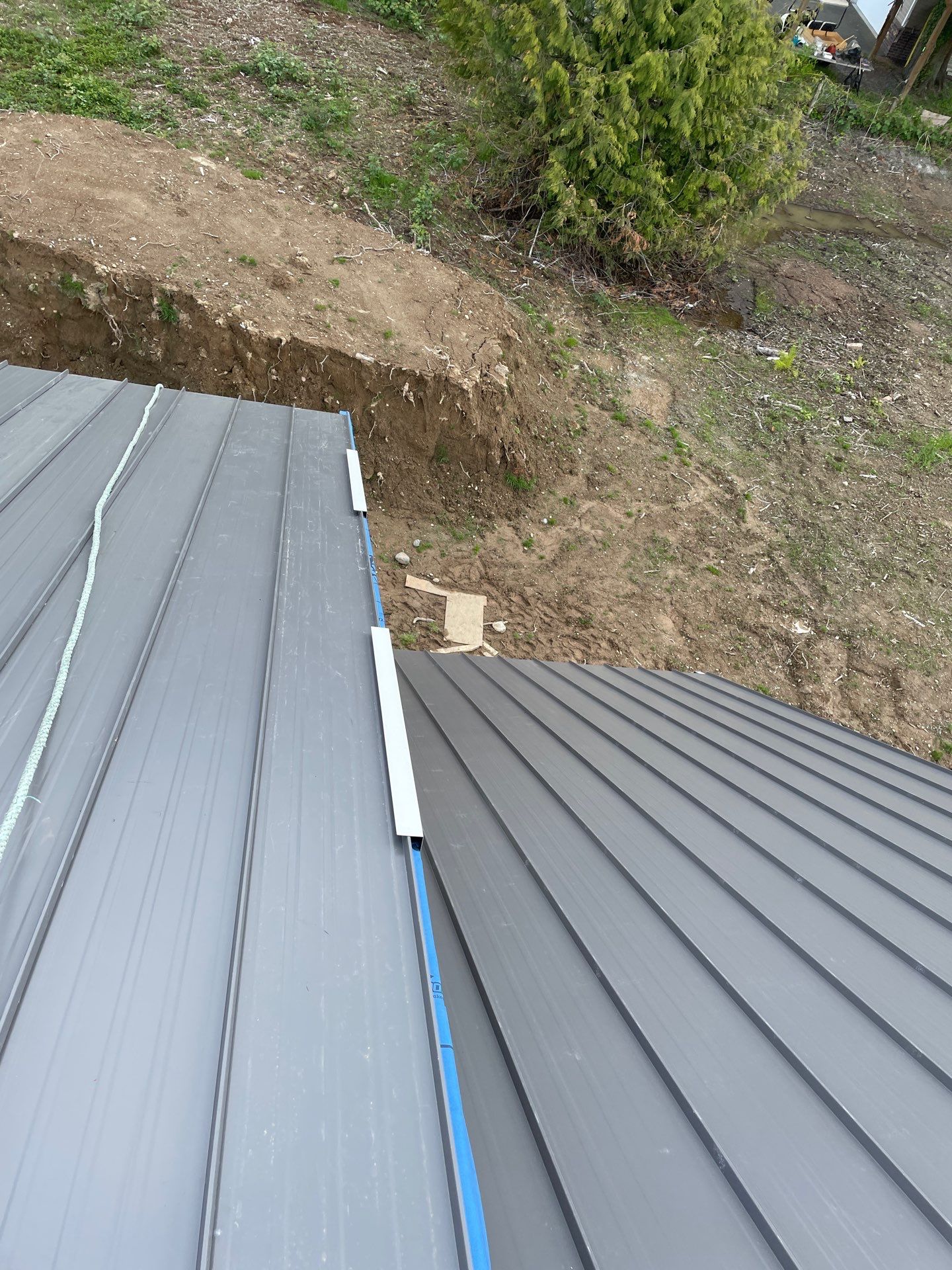 Residential Roofing Installation using 12" Prolok metal  by Top Notch Roofing Inc