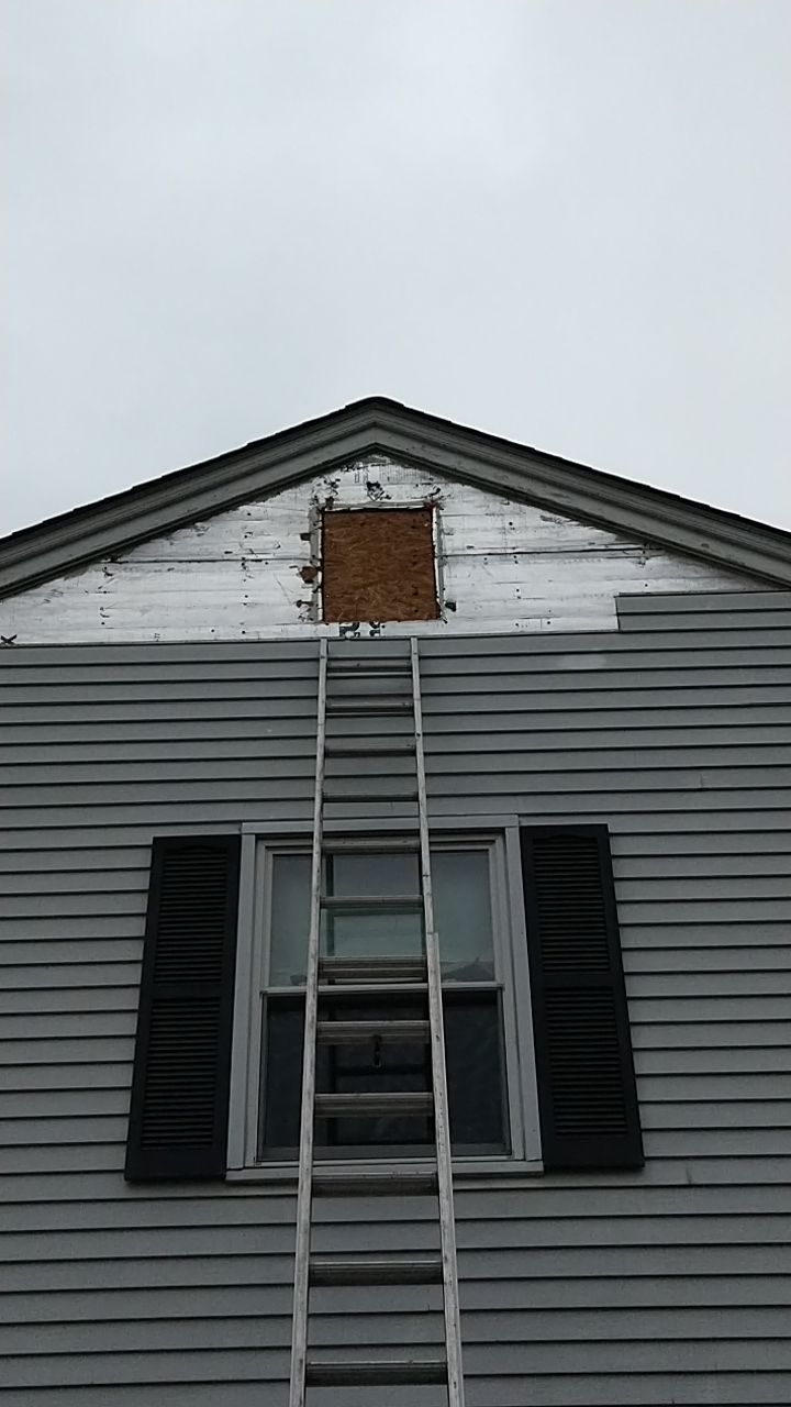 James Hardie Siding  using James Hardie Board and Batten, White by Absolute Roofing and Construction