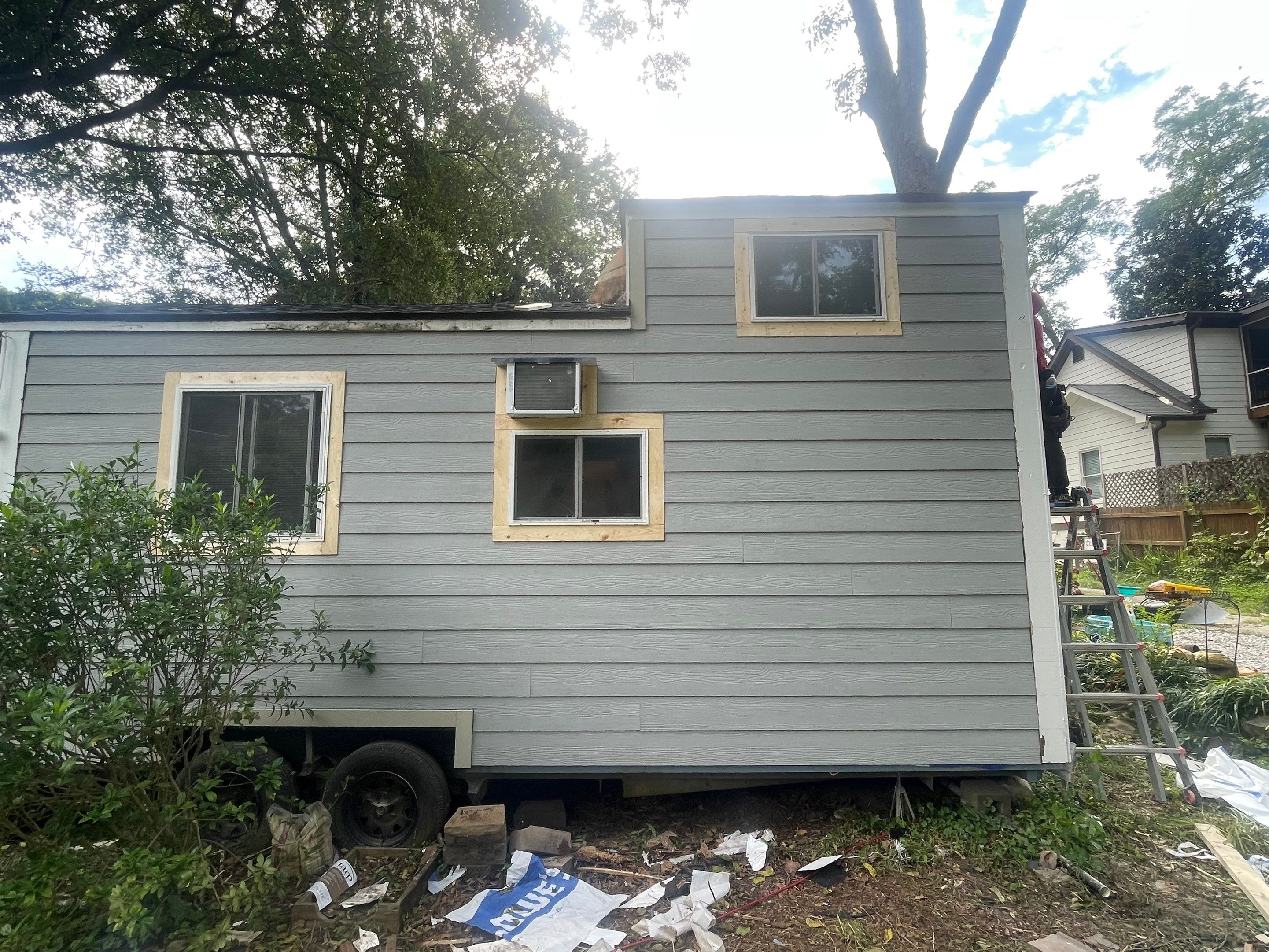tiny home remodel- siding,paint,roofing by Nailed It Roofing & Remodeling LLC