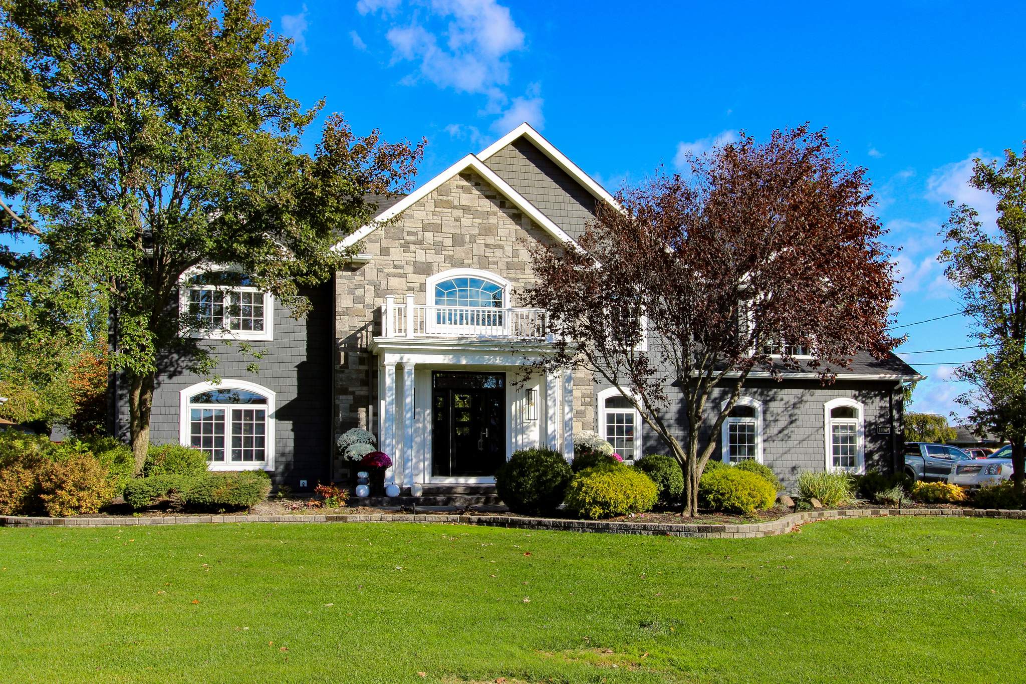 Exterior Renovations- Siding, Concrete, Railings, and Entry Door  by Ivy Lea Construction