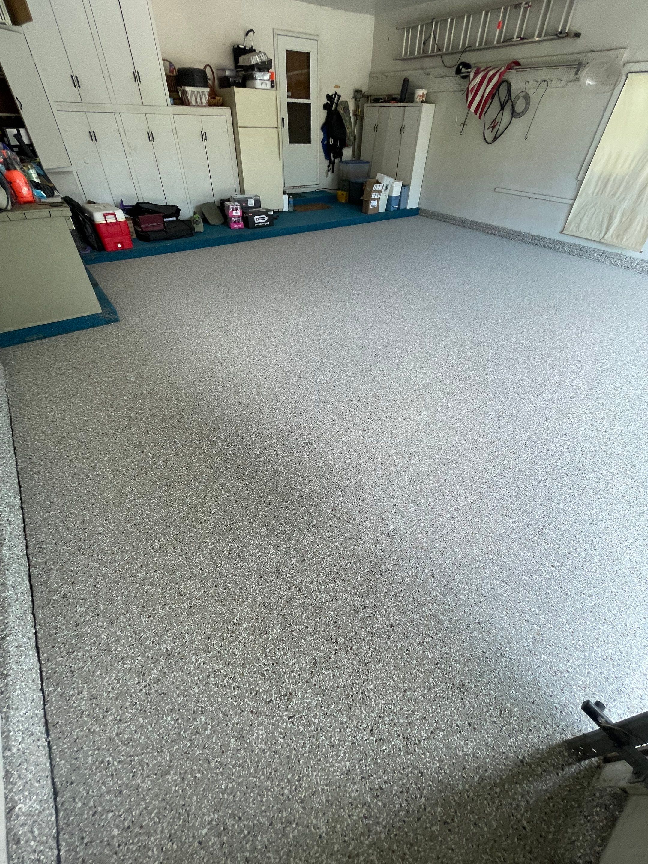 Custom Creekbed Garage Floor Coating in Sioux Falls by Select Painting, Coatings & Garage Cabinets