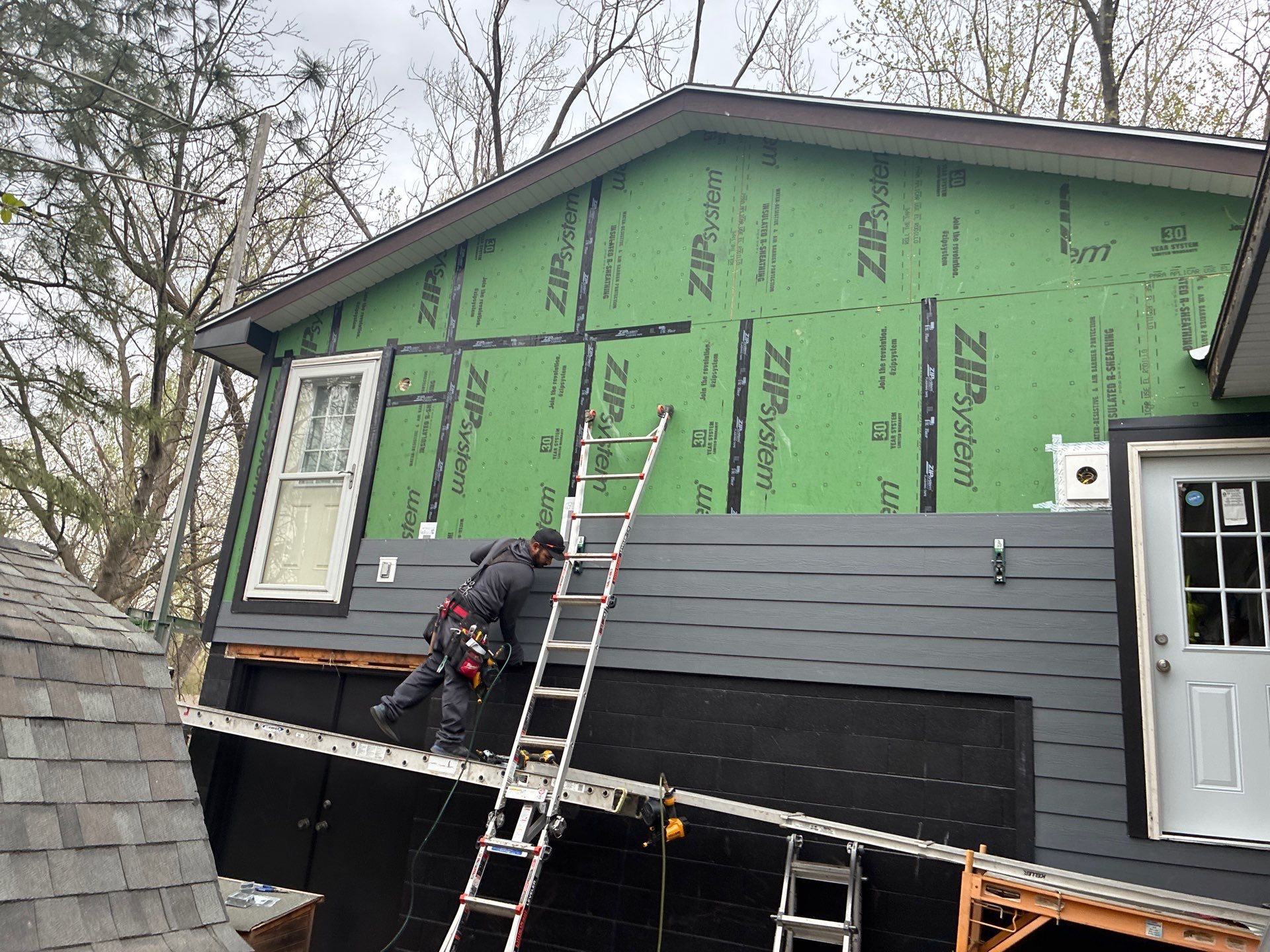 James Hardie Siding and Versetta Stone Exterior Renovation in Bellevue by Carps Complete Exteriors