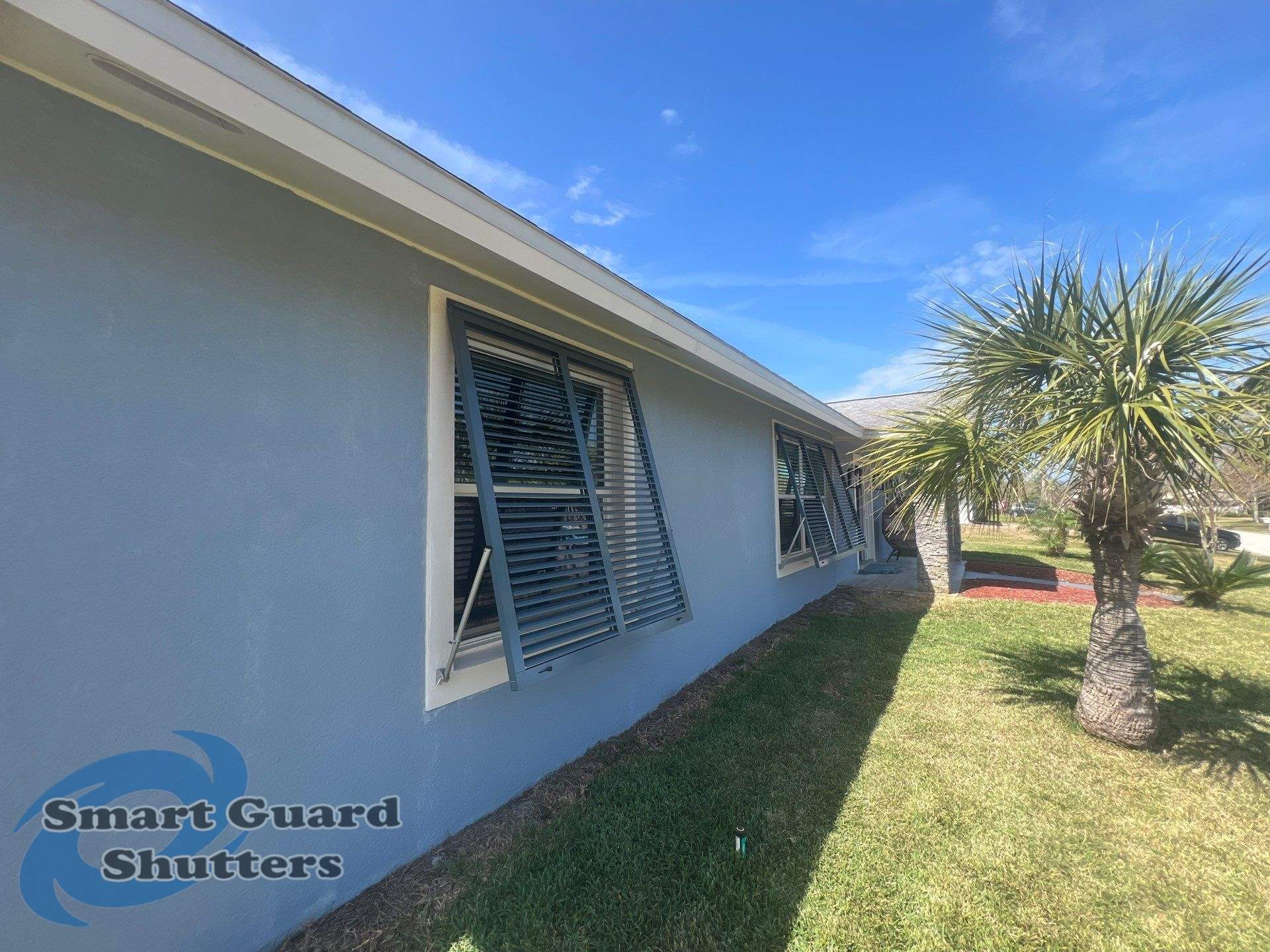 Impact Bahama Shutters in Grey Blue by Smart Guard Shutters