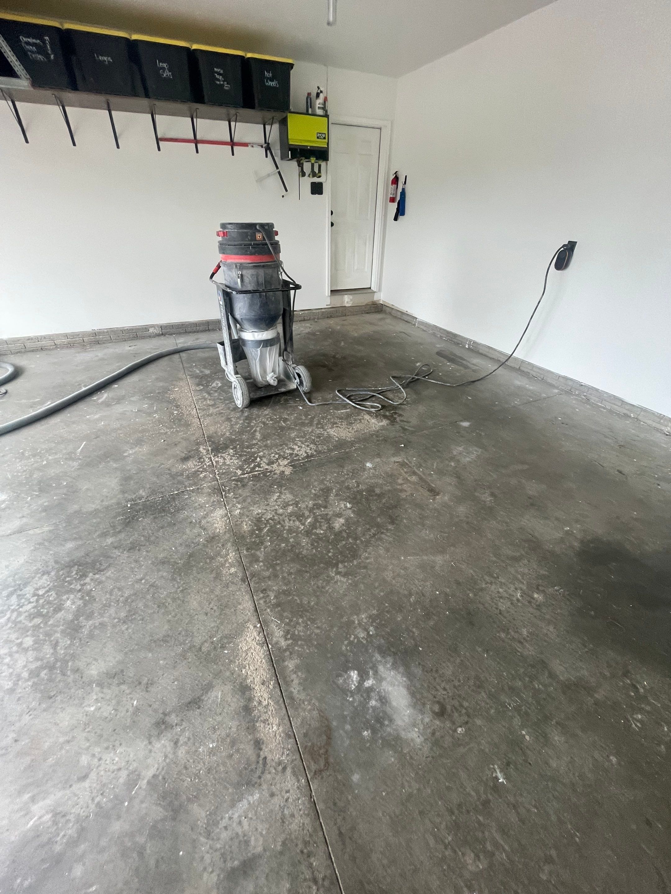 Tidal Wave Flake Garage Floor Installation in Sioux Falls by Select Painting, Coatings & Garage Cabinets