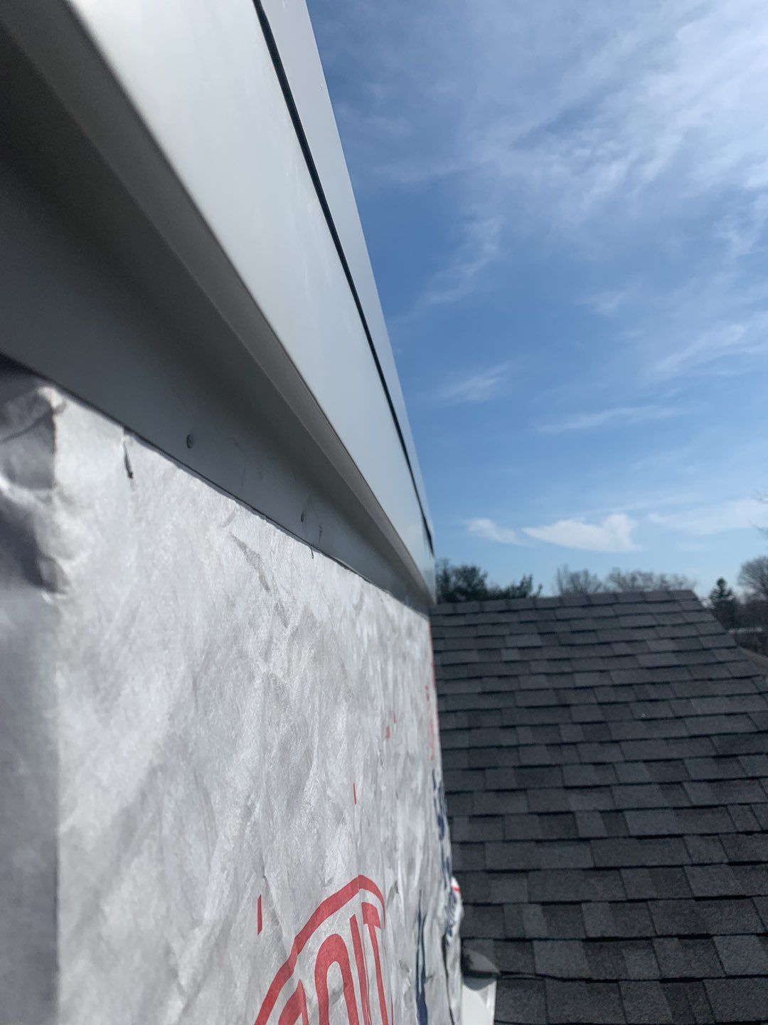 Commercial Roofing Installation using EPDM with white gutters by A Plus Exterior