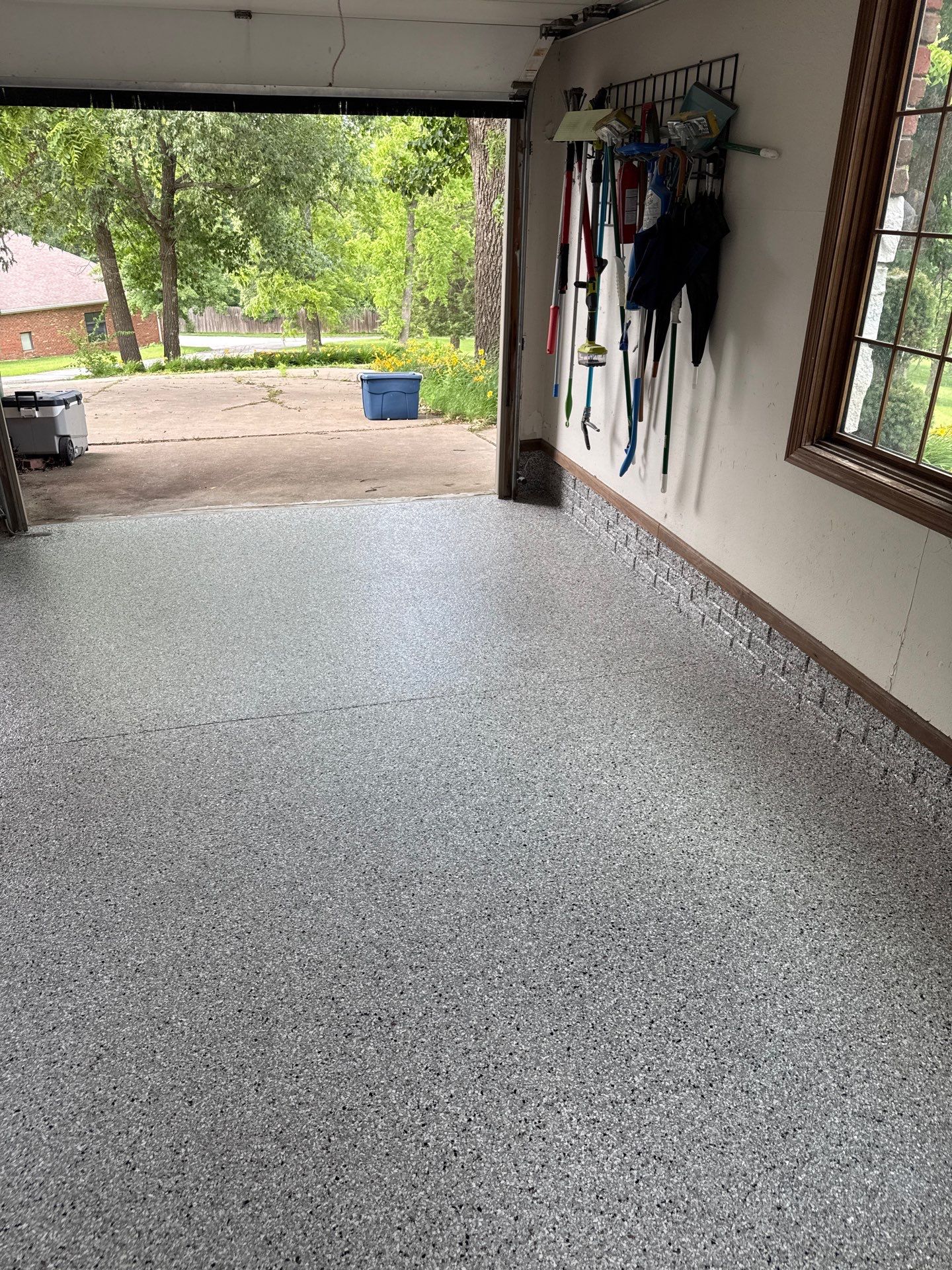 Coyote Flake Epoxy Garage Floor Coating in Earlham by Revival Concrete Coatings