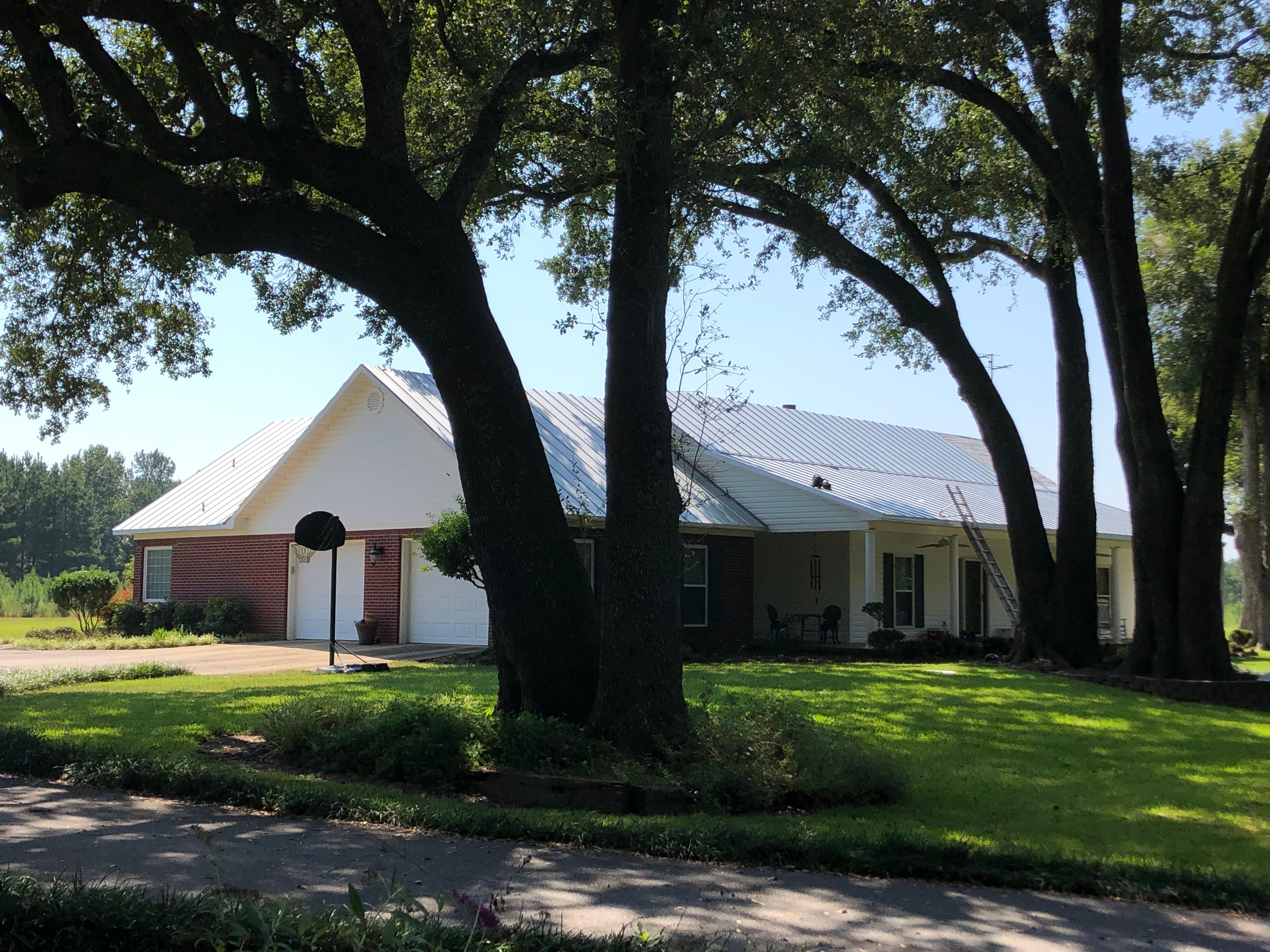 Residential Roofing Installation using Metal roofing by American Roofing & Construction LLC
