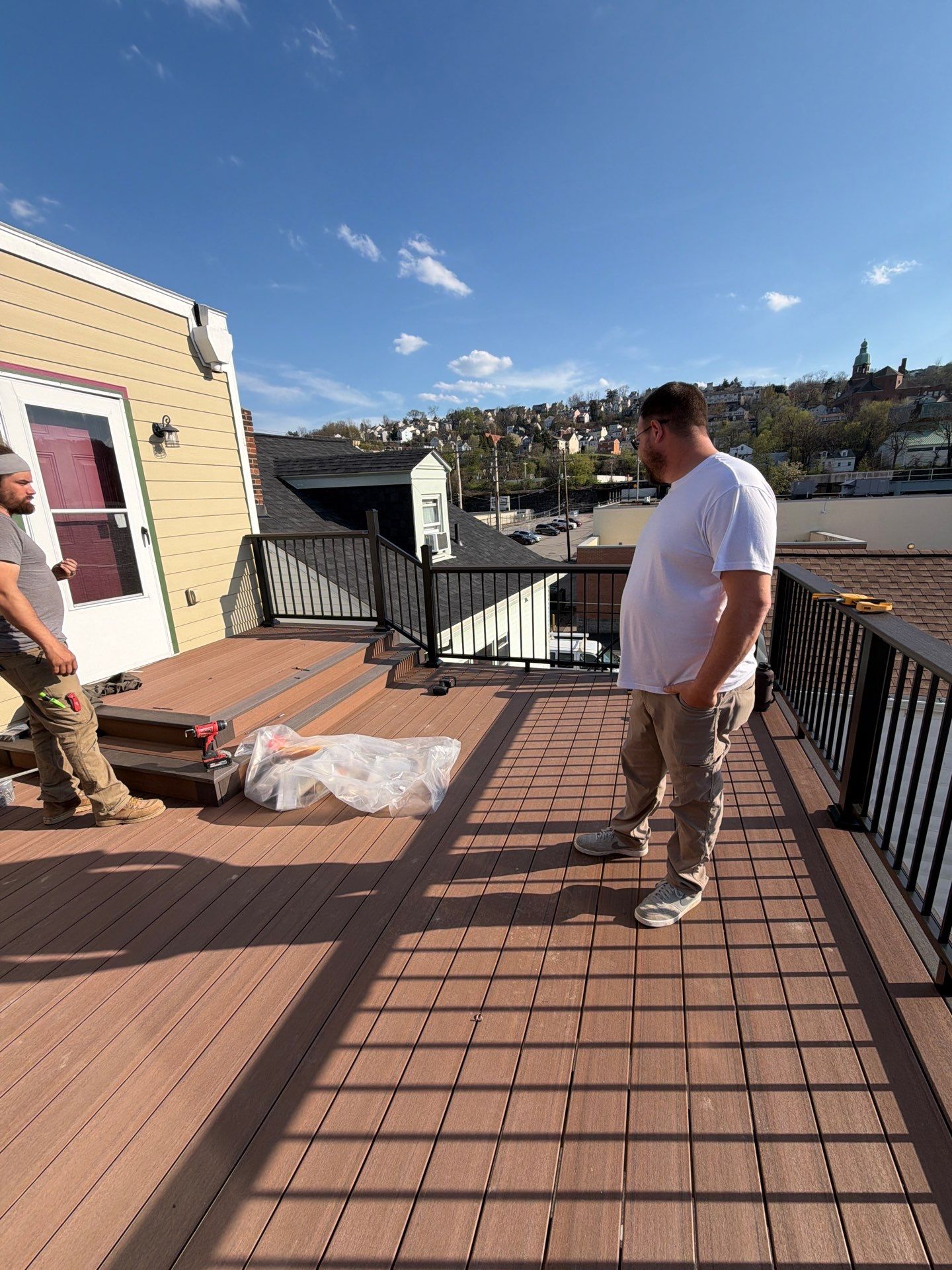 Larry Dietrich Spiral stair and deck by Cousins Roofing Siding & Decks