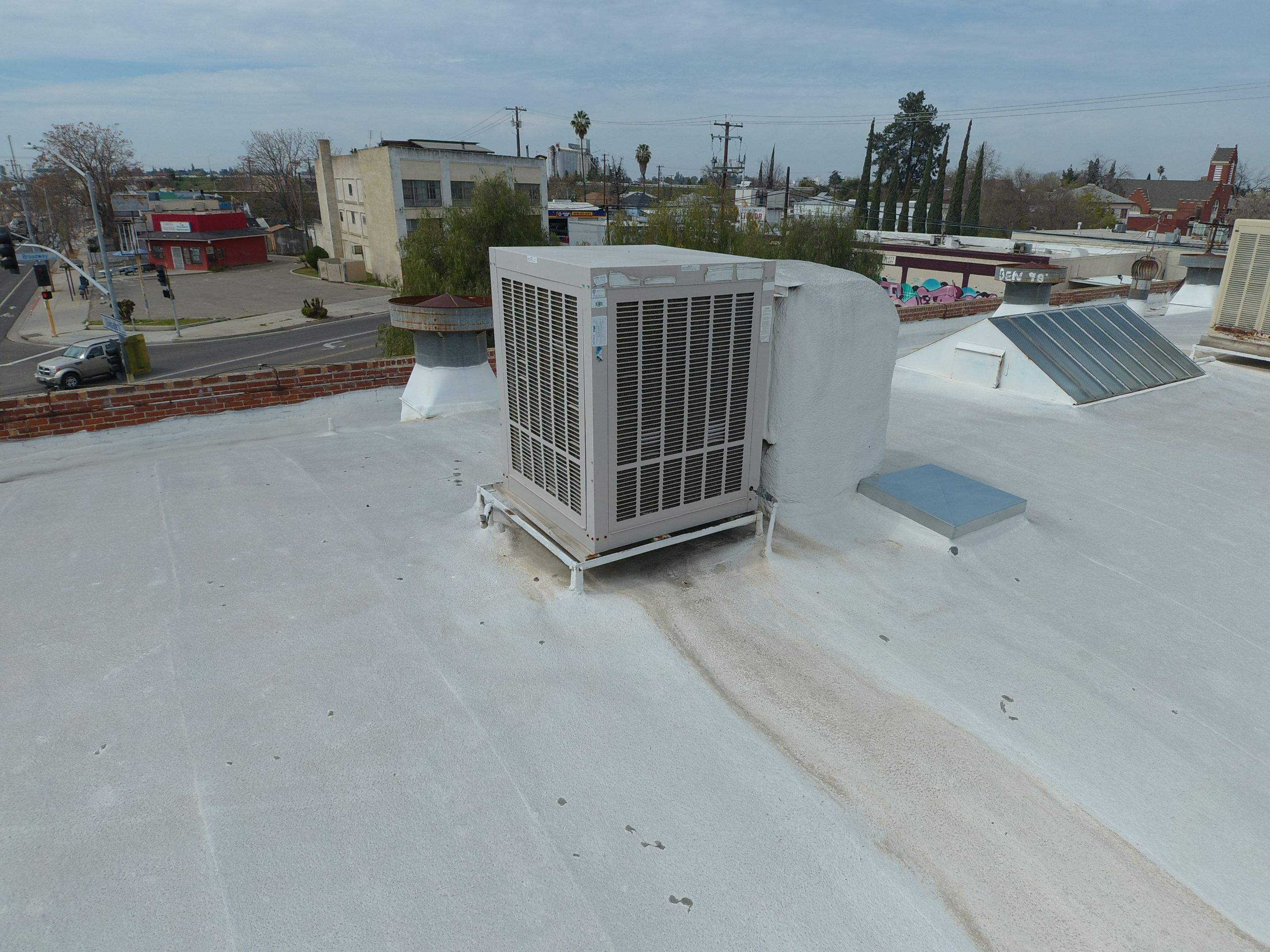 Polyurethane foam roof refurbish and recoating by Straight Edge Roofing Inc