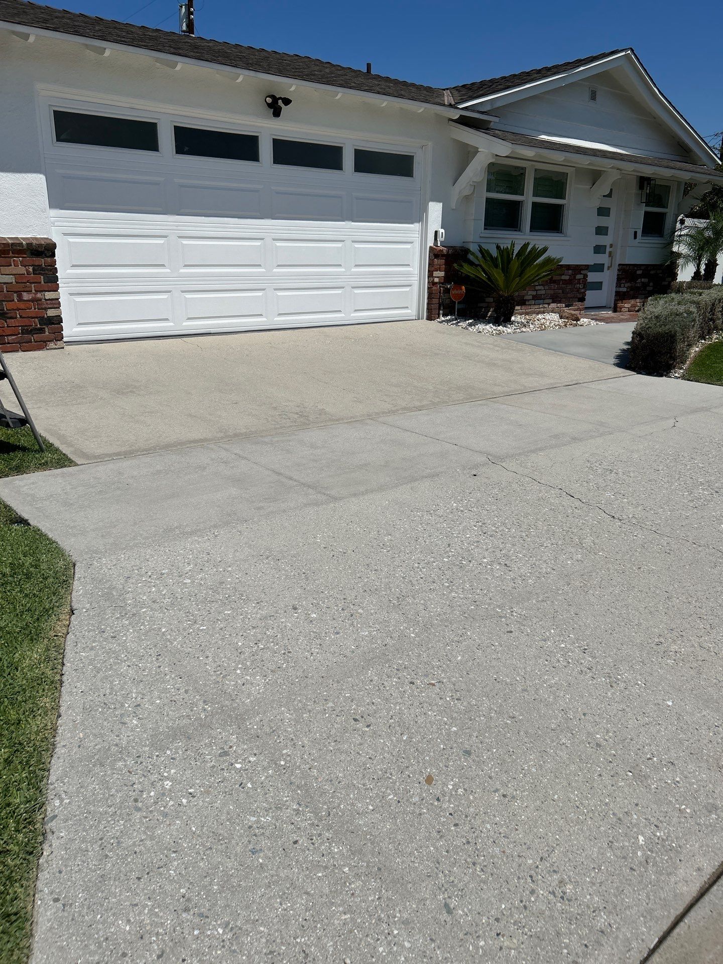 Sandblasting Paint Off Concrete Driveway In Downey, CA by La Power Washing Inc