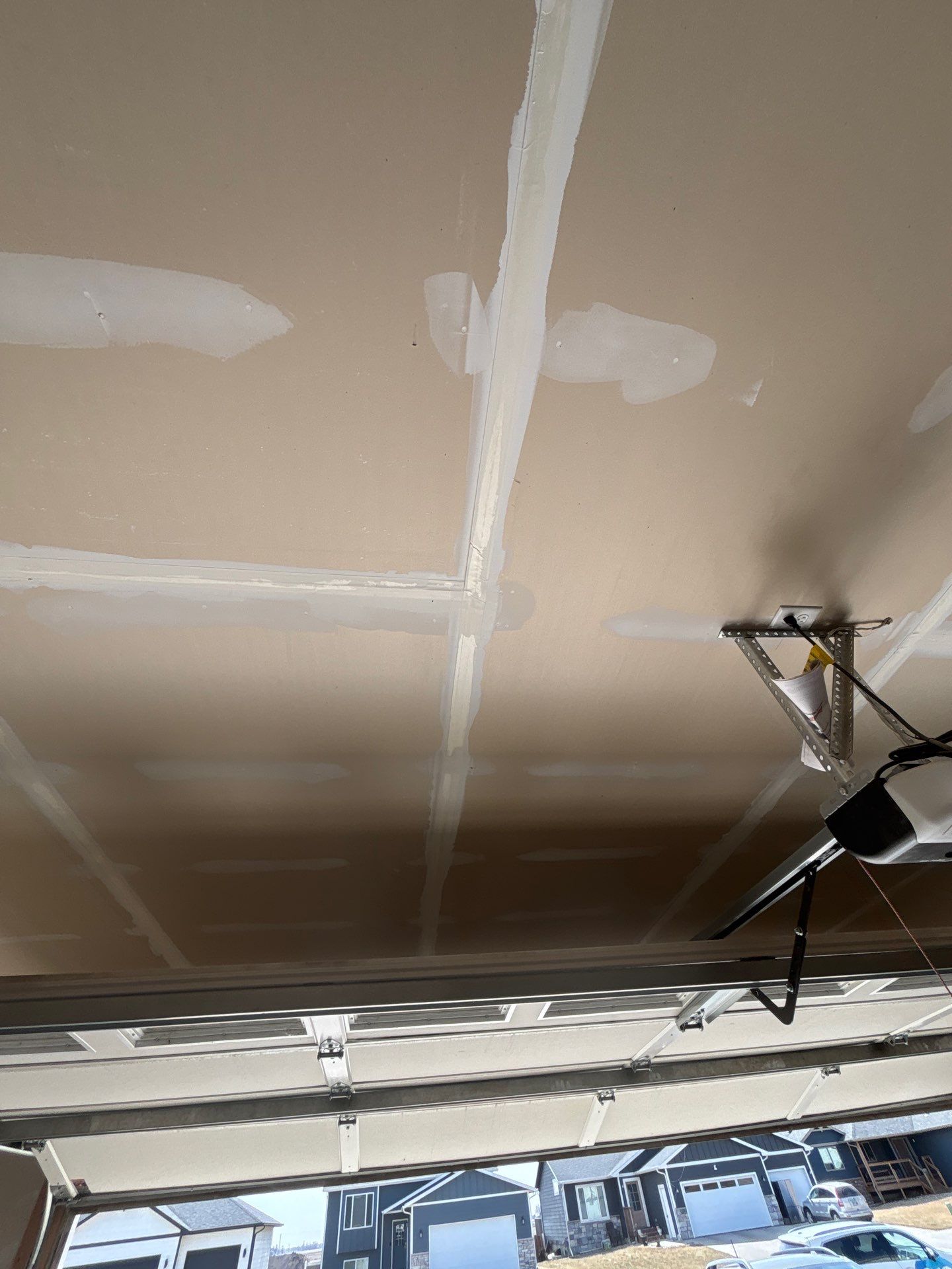 Grey Flake Epoxy Garage Floor Coating in Sioux Falls by Select Painting, Coatings & Garage Cabinets