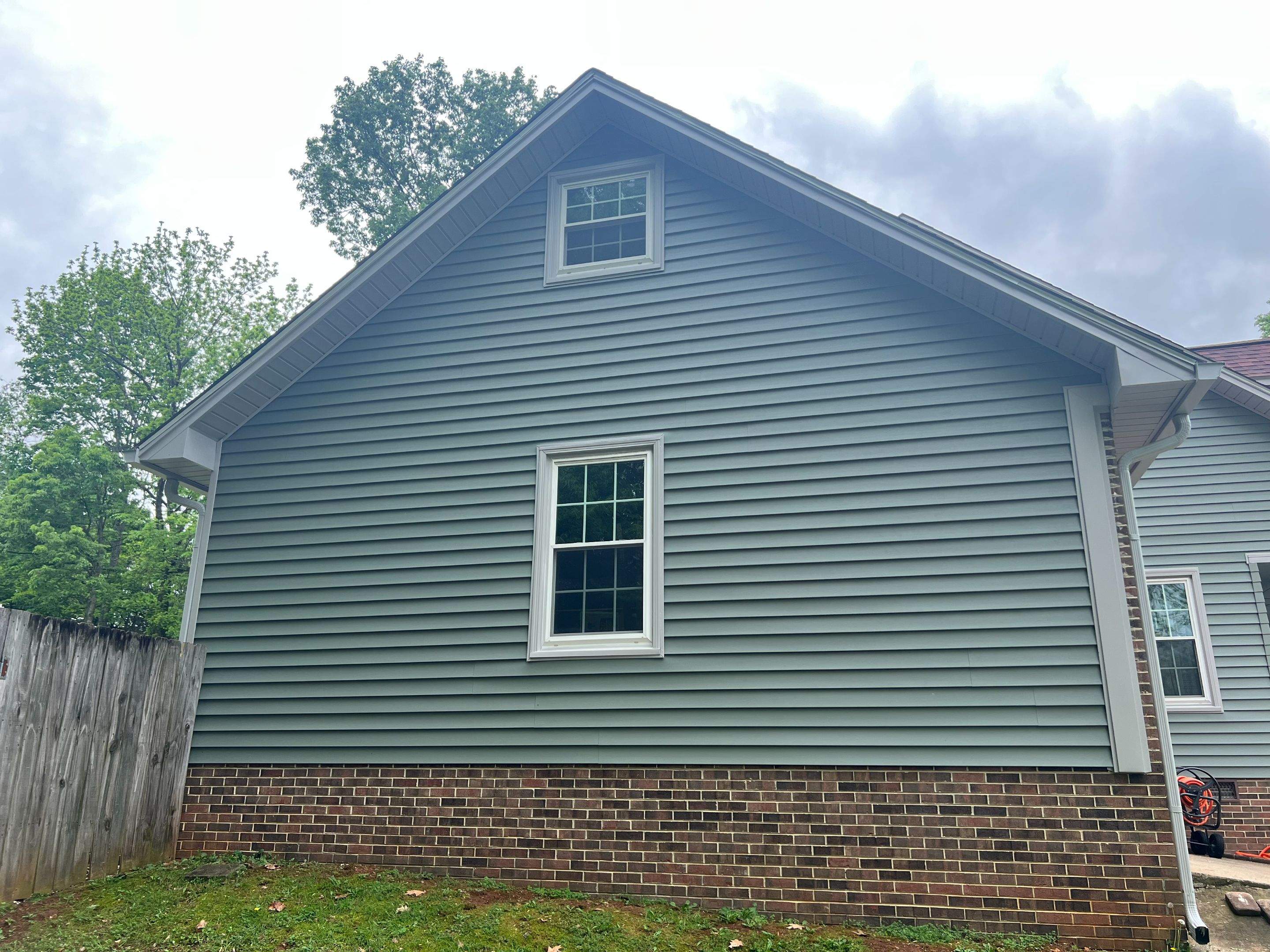 Siding Replacement using Mastic Carvedwood Vinyl Plank by Freedom Exteriors