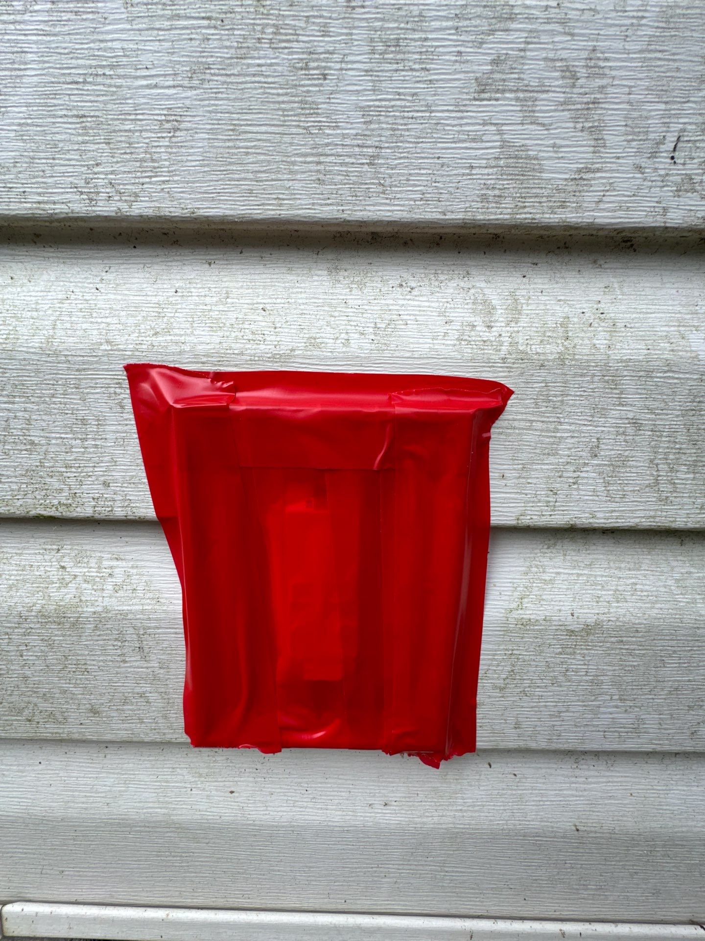 the service shown is cleaning the exterior of a house siding to remove dirt and mildew buildup