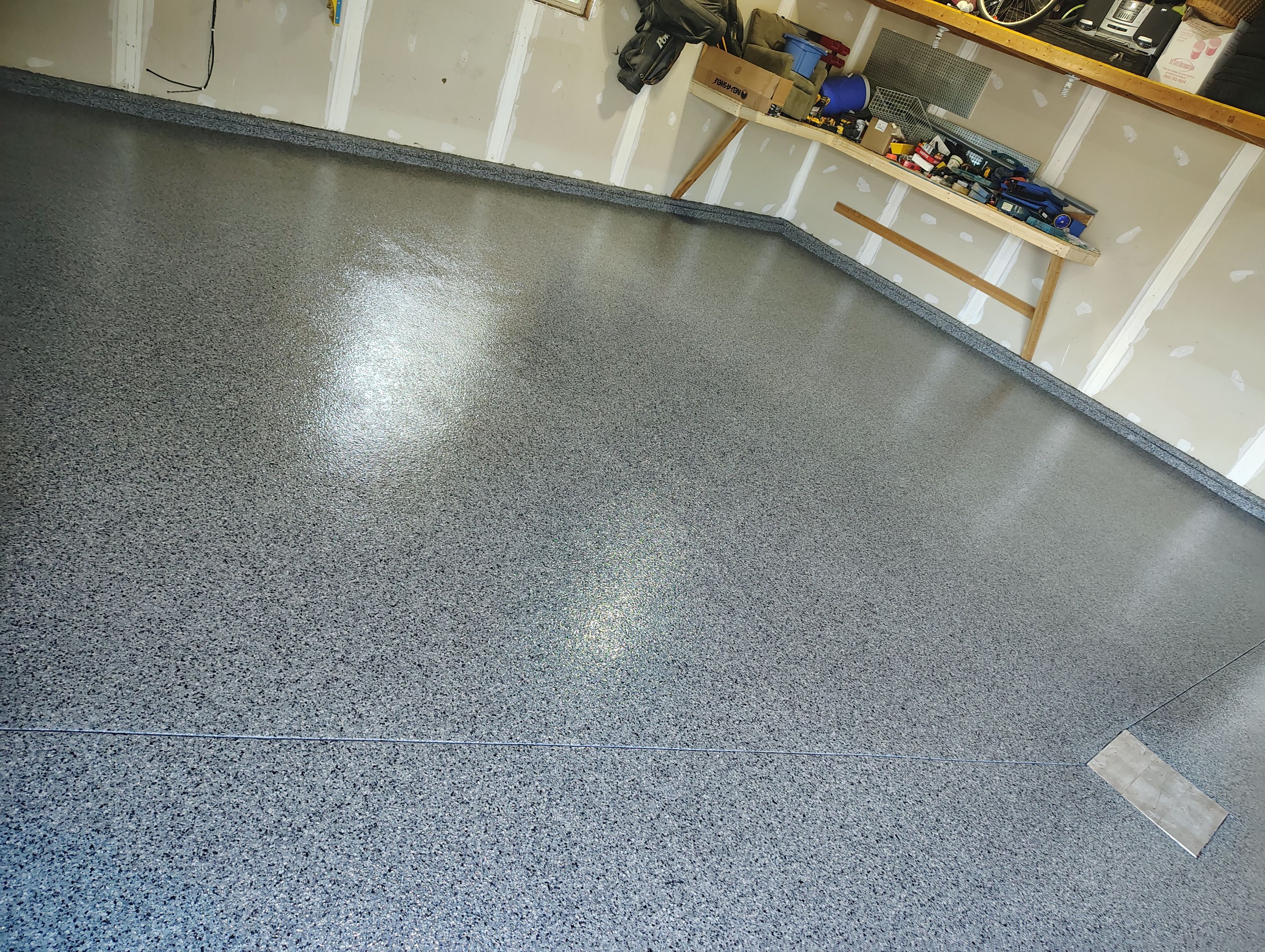 Sioux Falls Garage Concrete Grinding and Nightfall Decorative Chip Coating by Select Painting, Coatings & Garage Cabinets