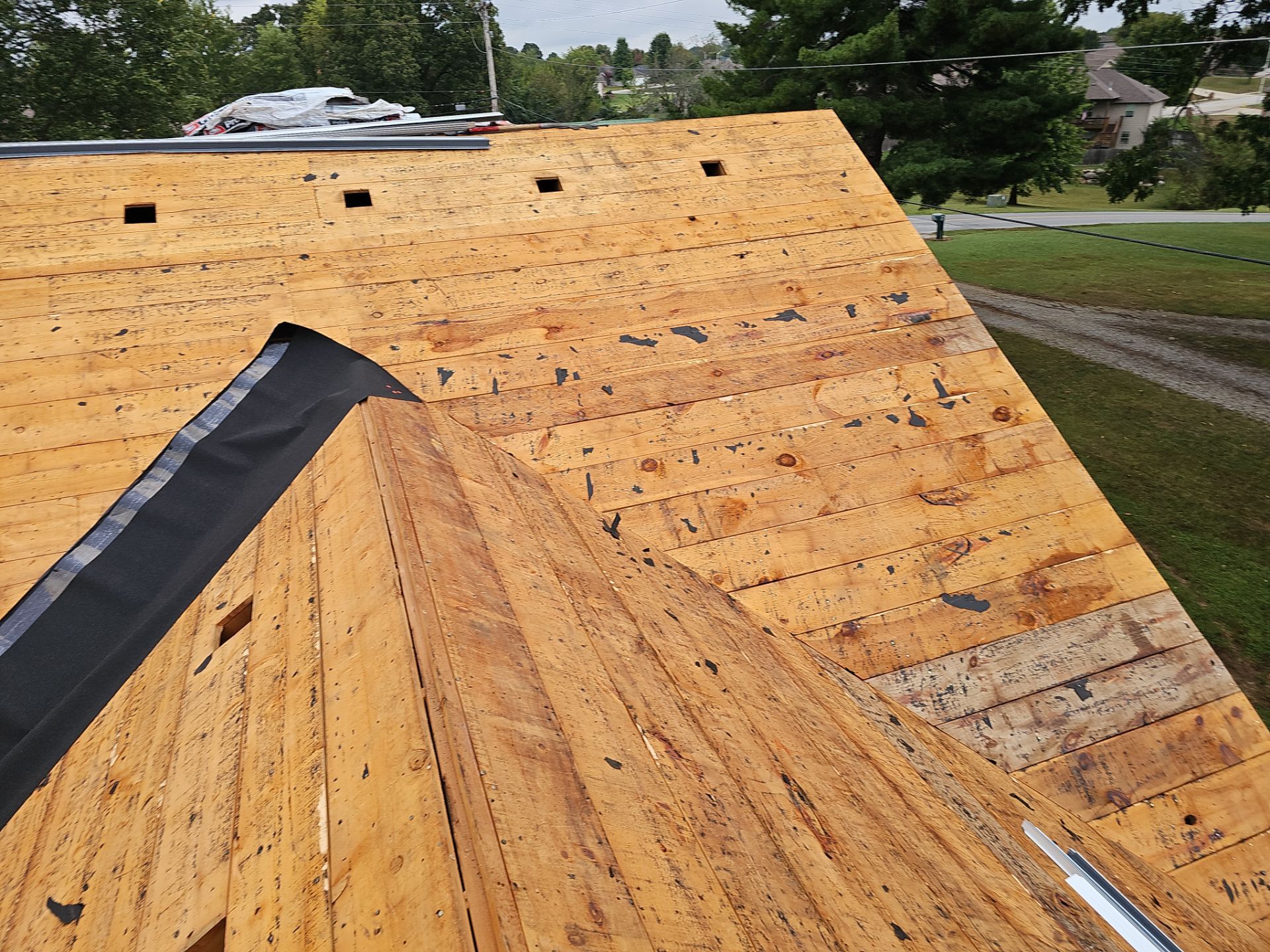 Residential Roofing Install - Green Atlas Pinnacle Pristine Shingles - White Gutters & Downspouts  by Titan Commercial & Residential Roofing 