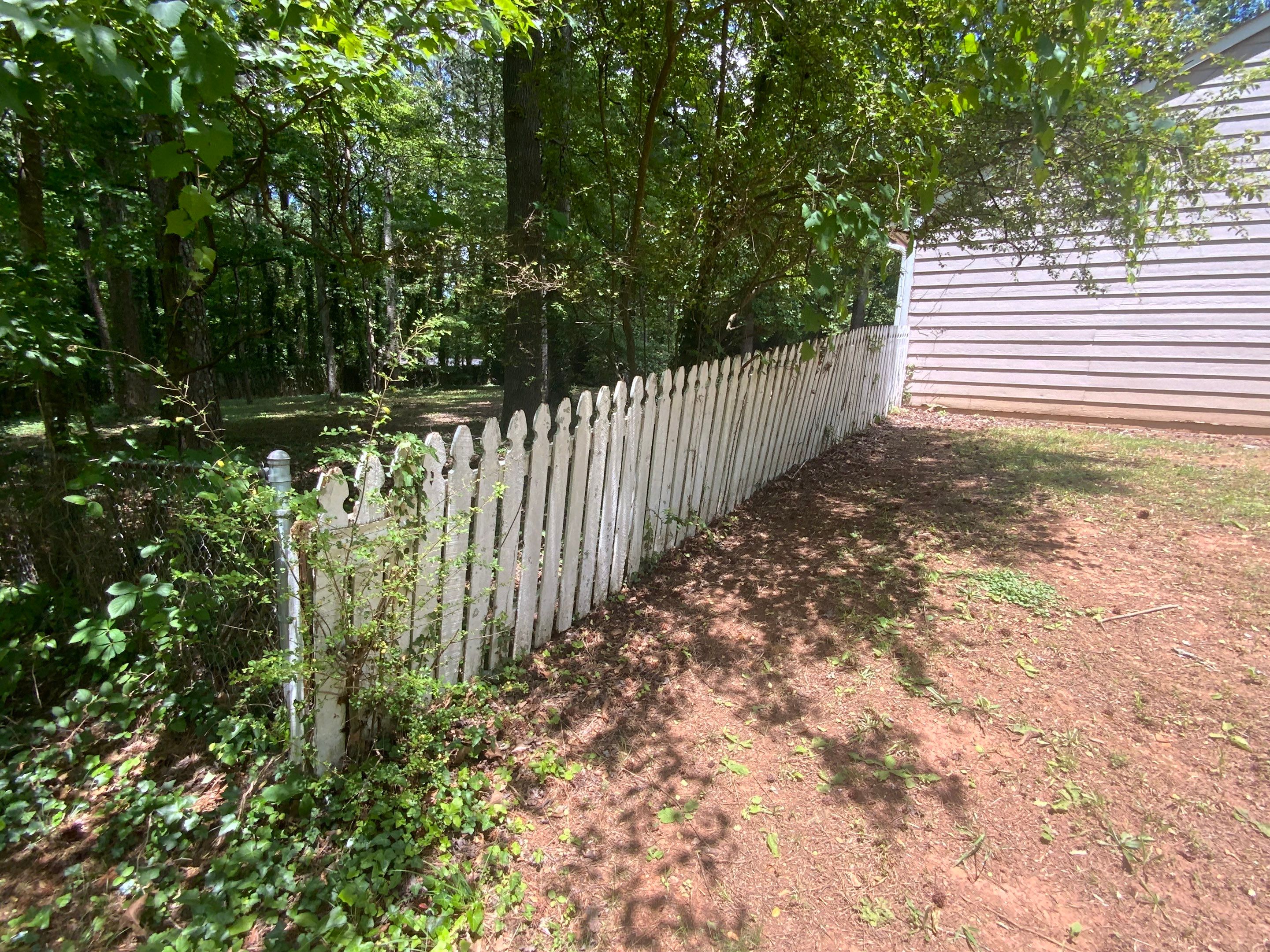 Exterior Siding Painting and Picket Fence Installation in Powder Springs by Swift Home Renovations