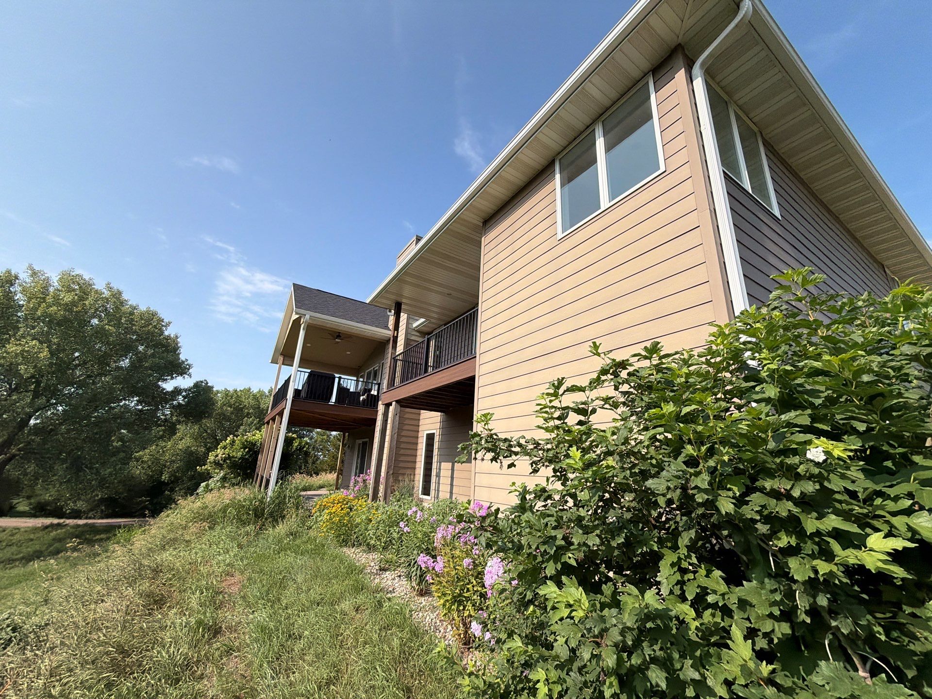 Sioux Falls Residential Exterior Painting and Siding Refresh by Select Painting, Coatings & Garage Cabinets