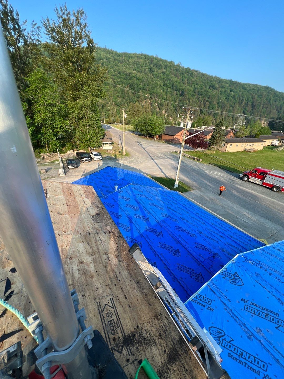 Commercial Roofing Installation using 12" Prolok metal  by Top Notch Roofing Inc