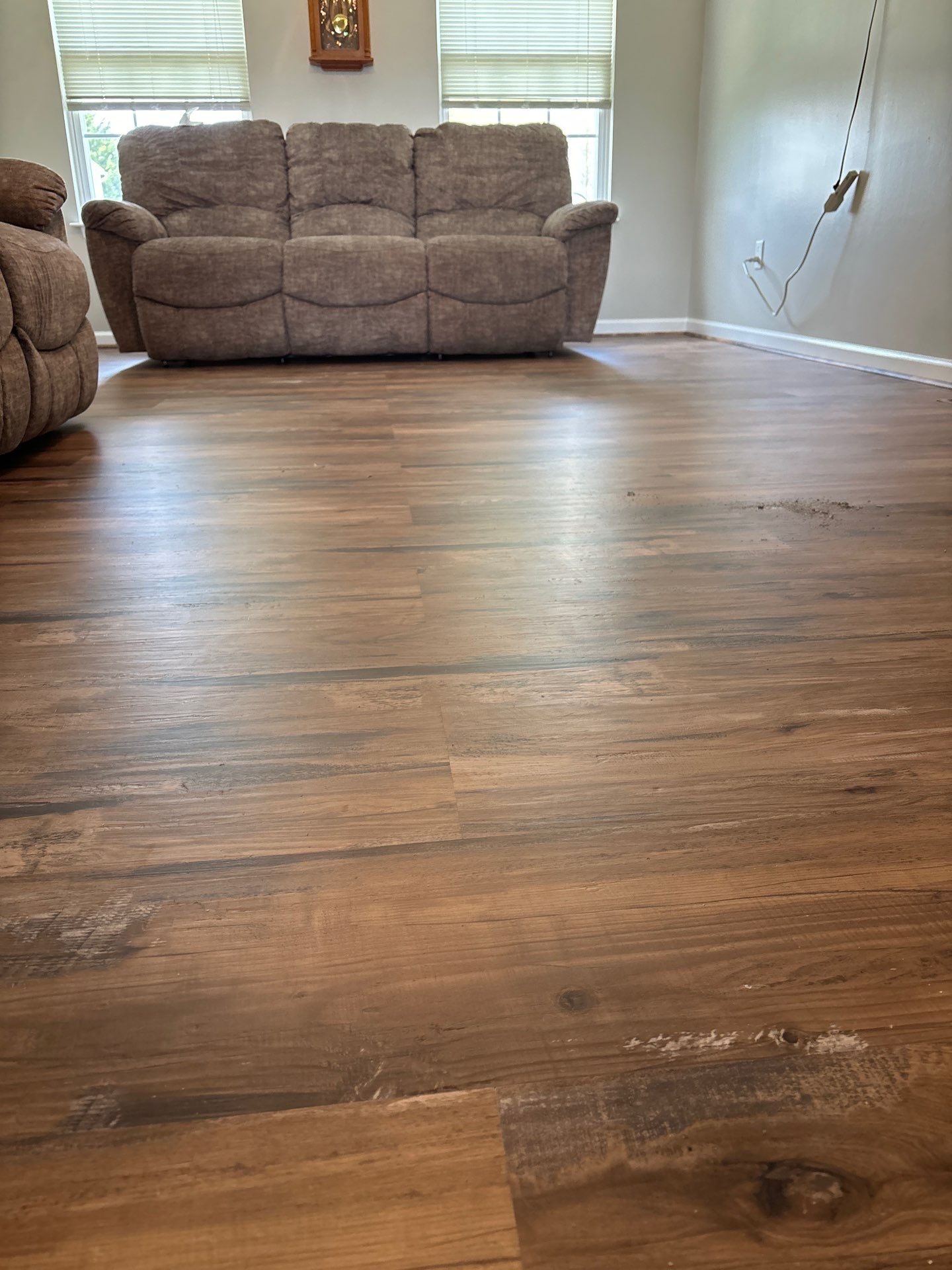 Living room LVP Flooring install  by Laser Focused Solutions LLC