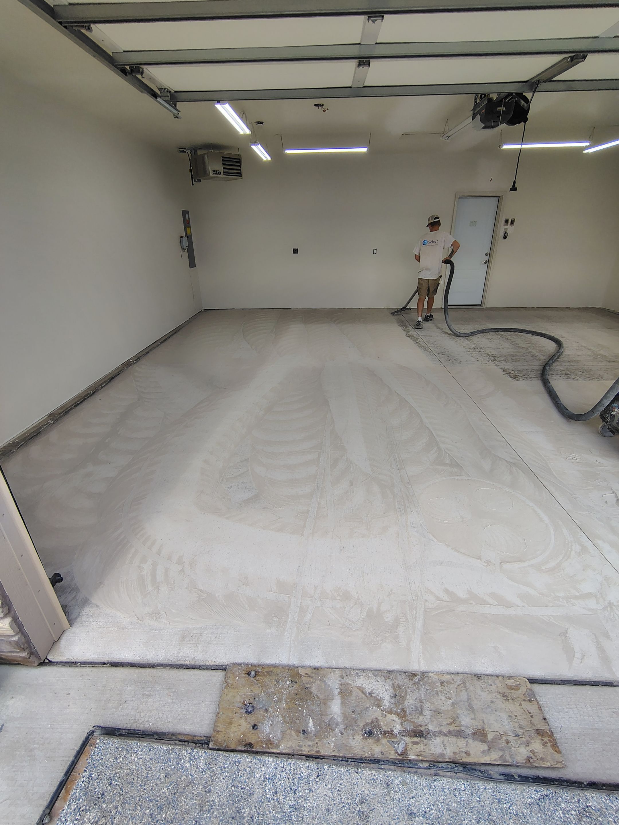 Garage Floor Coating with Coyote Decorative Chip in Tea by Select Painting, Coatings & Garage Cabinets