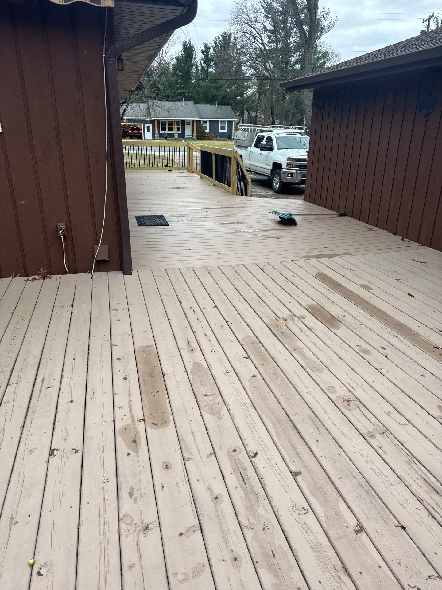 Muskegon Deck Restoration with Pressure Treated Railings and Wood Staining by Gordon Painting