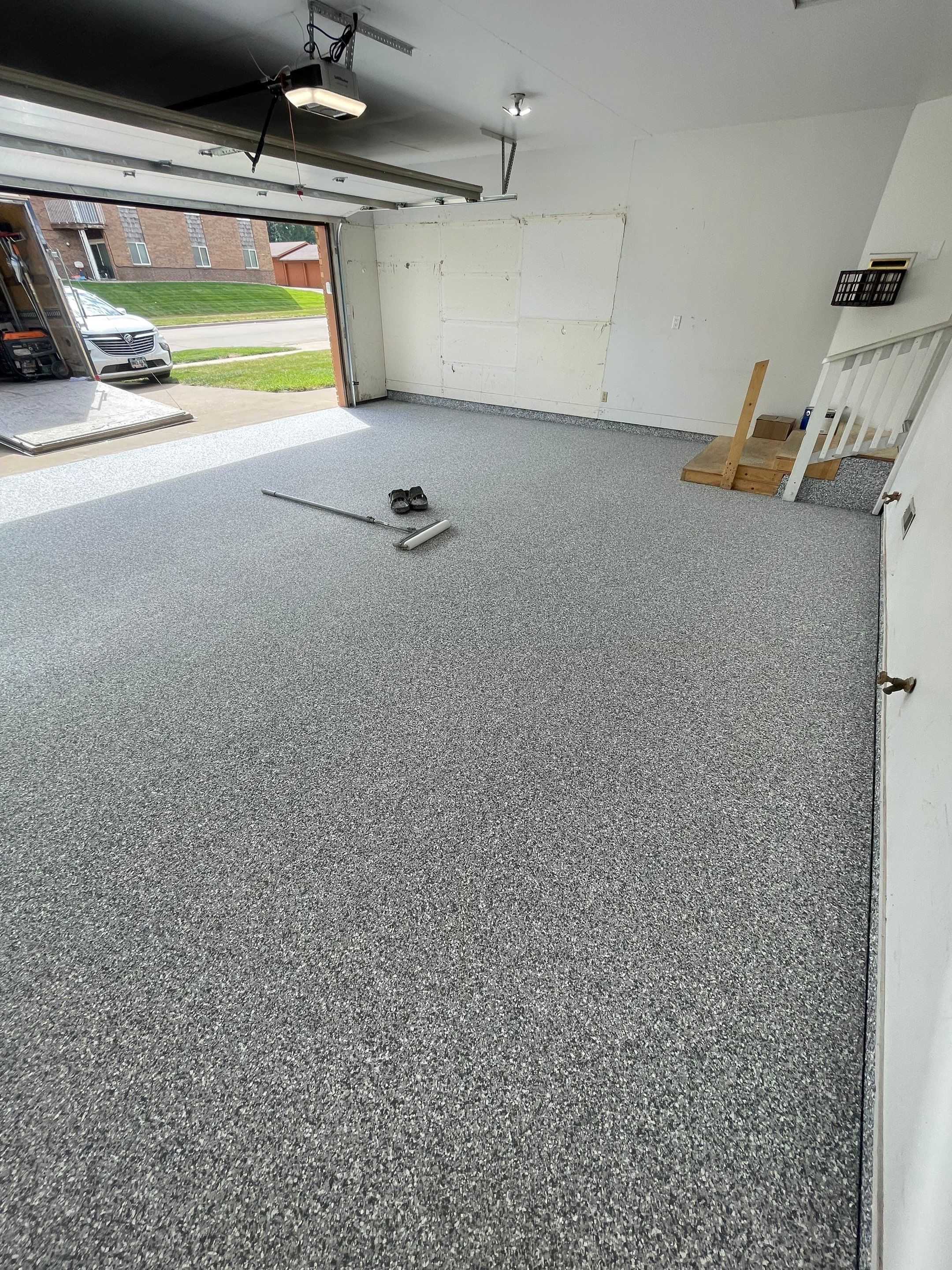 Grey Speckled Concrete Coating for Residential Garage in Yankton by Select Painting, Coatings & Garage Cabinets
