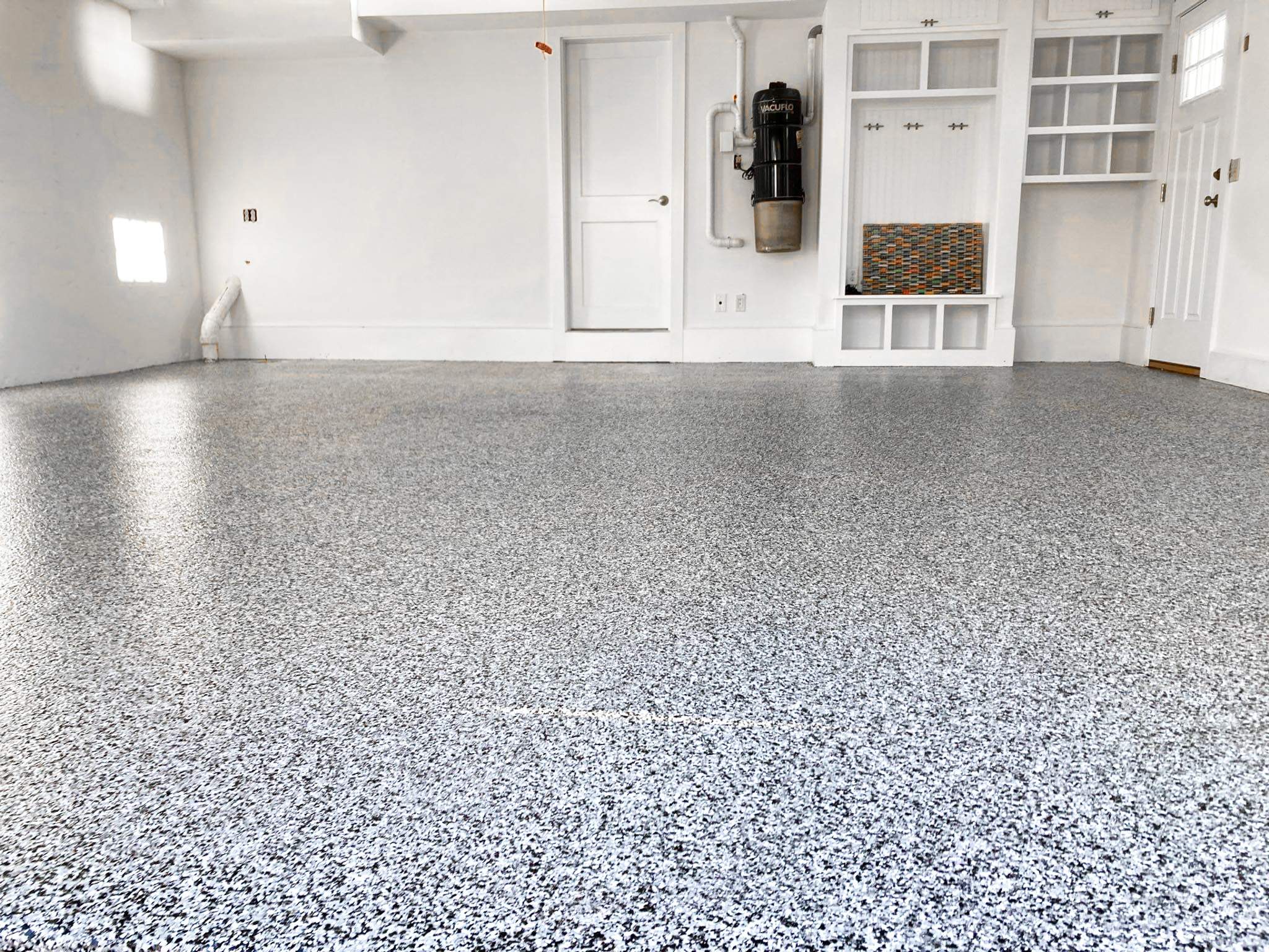 Garage in Mashpee, MA 02649 by Symphony Concrete Coatings