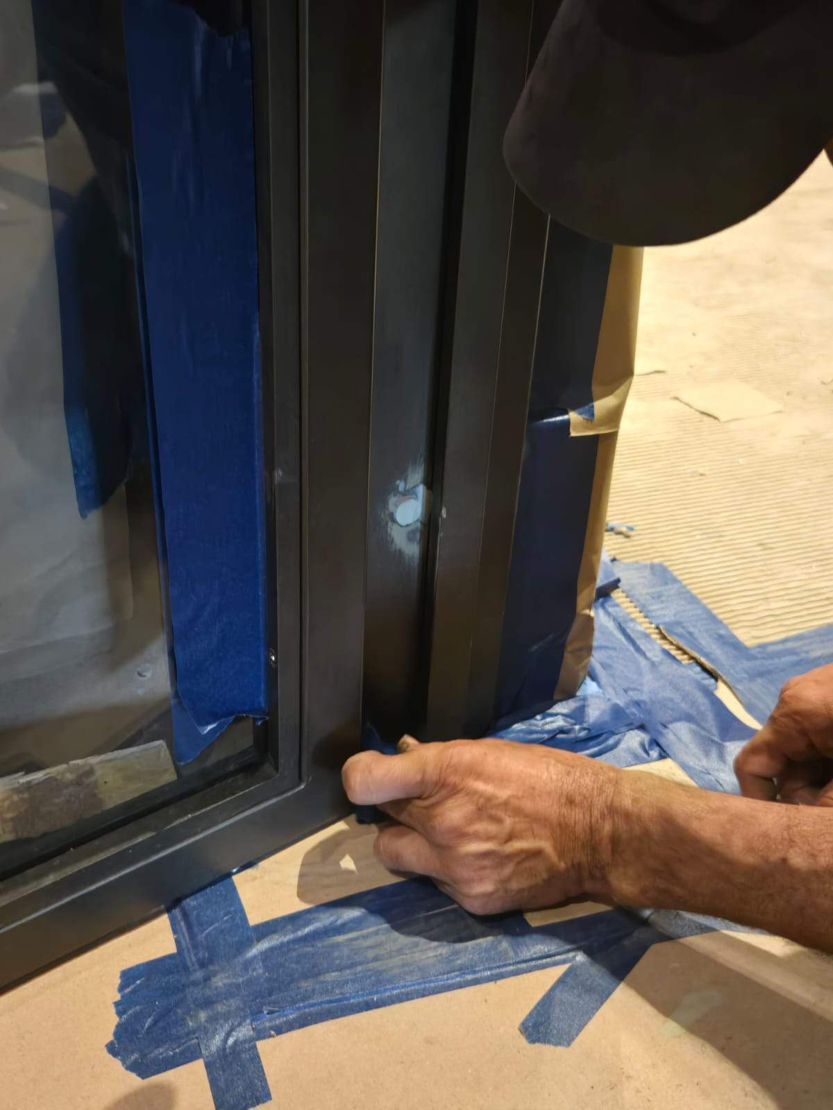 Modern Black Frame Double Door Installation with Custom Radial Hardware by Solara Custom Living