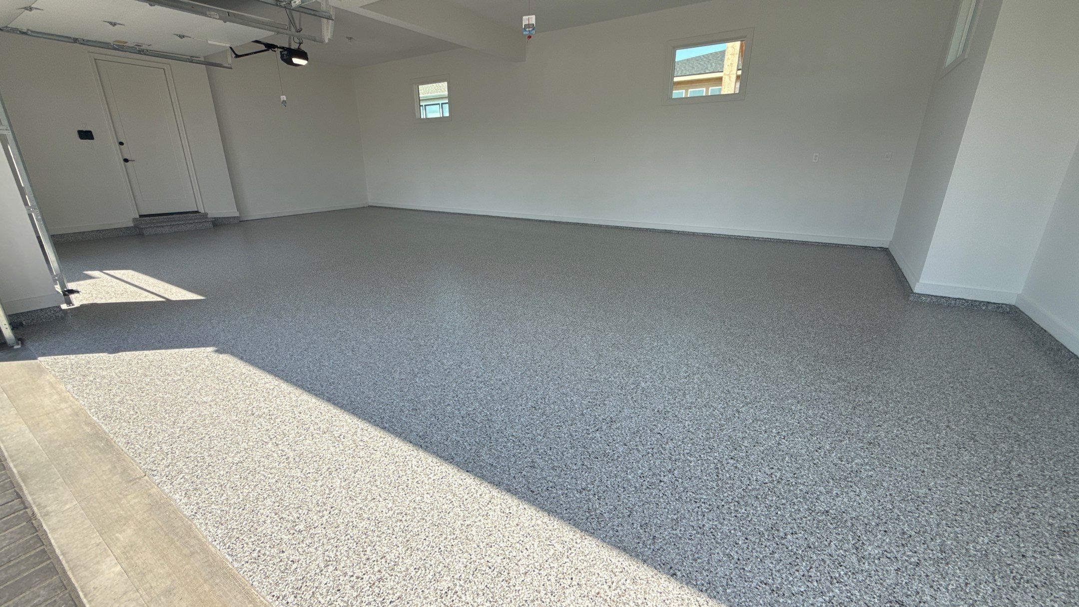Custom Garage Epoxy Flake Floor Coating in Leawood by Banner Garage