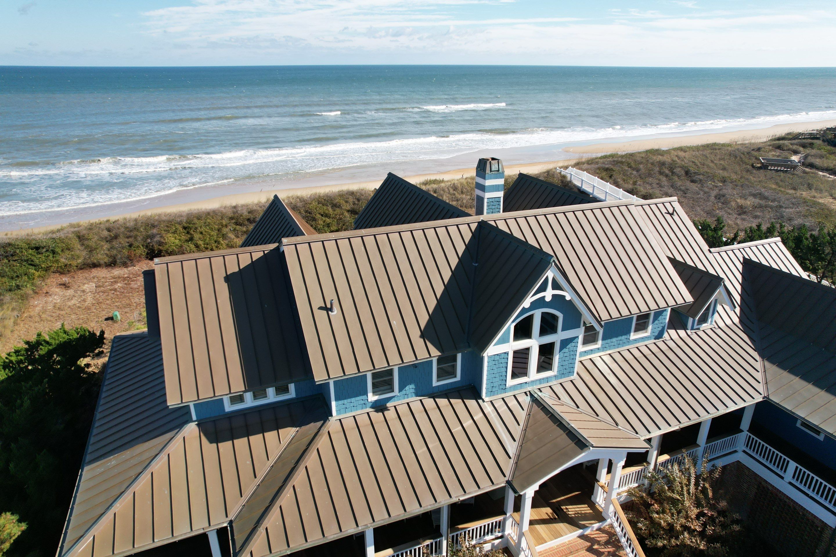 Large Metal Roof Transformation by Gallop Roofing & Remodeling, Inc.
