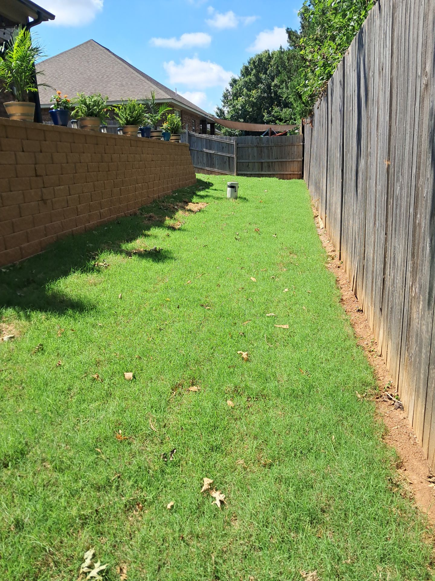 Custom Segmental Block Retaining Wall and Sod Installation in Lawton by Clays Services Inc