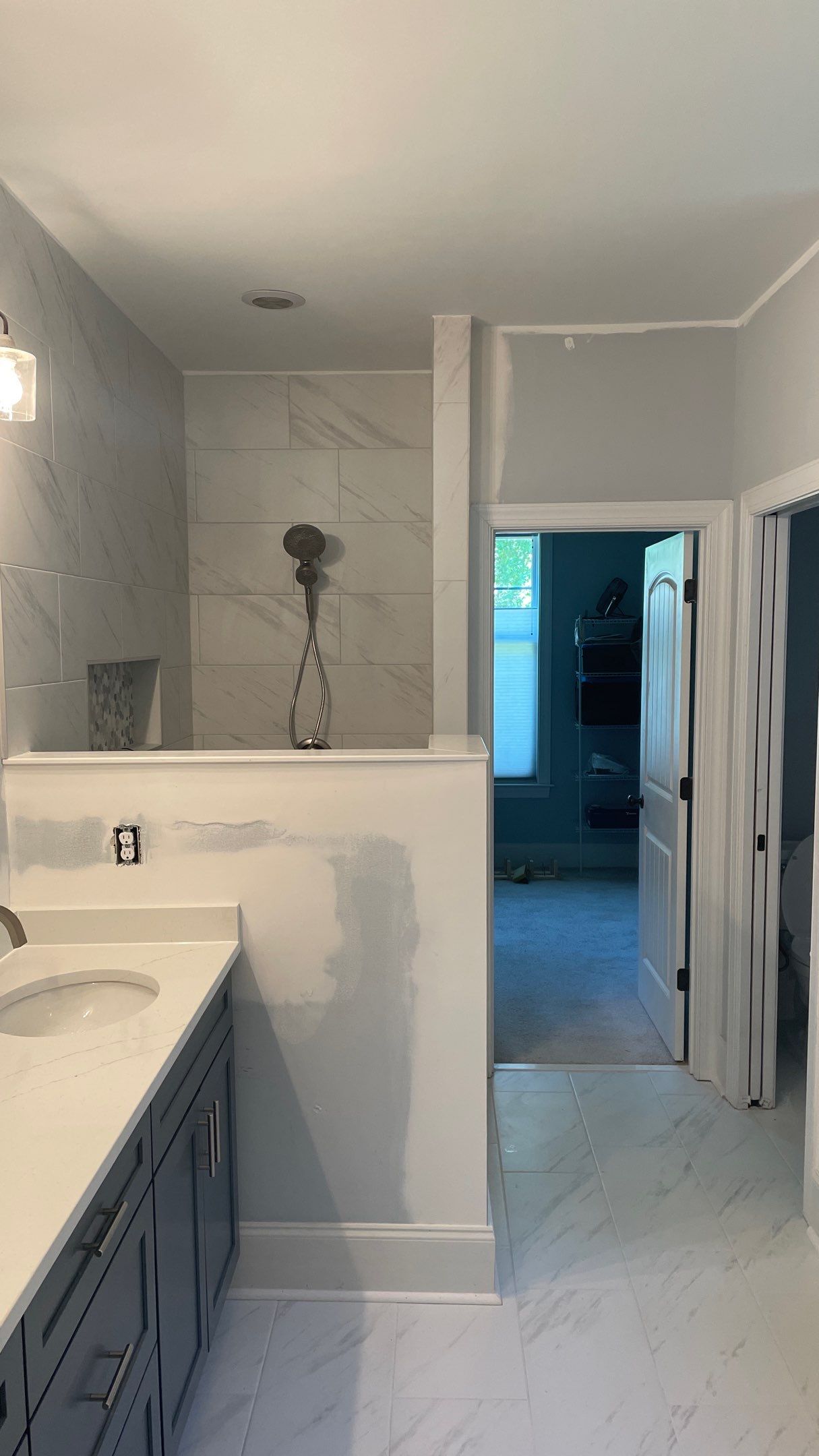 Bright Bathroom Remodel with Wall Removal, Stand Alone Tub and New Vanity by Footprints Floors of Coastal Carolina