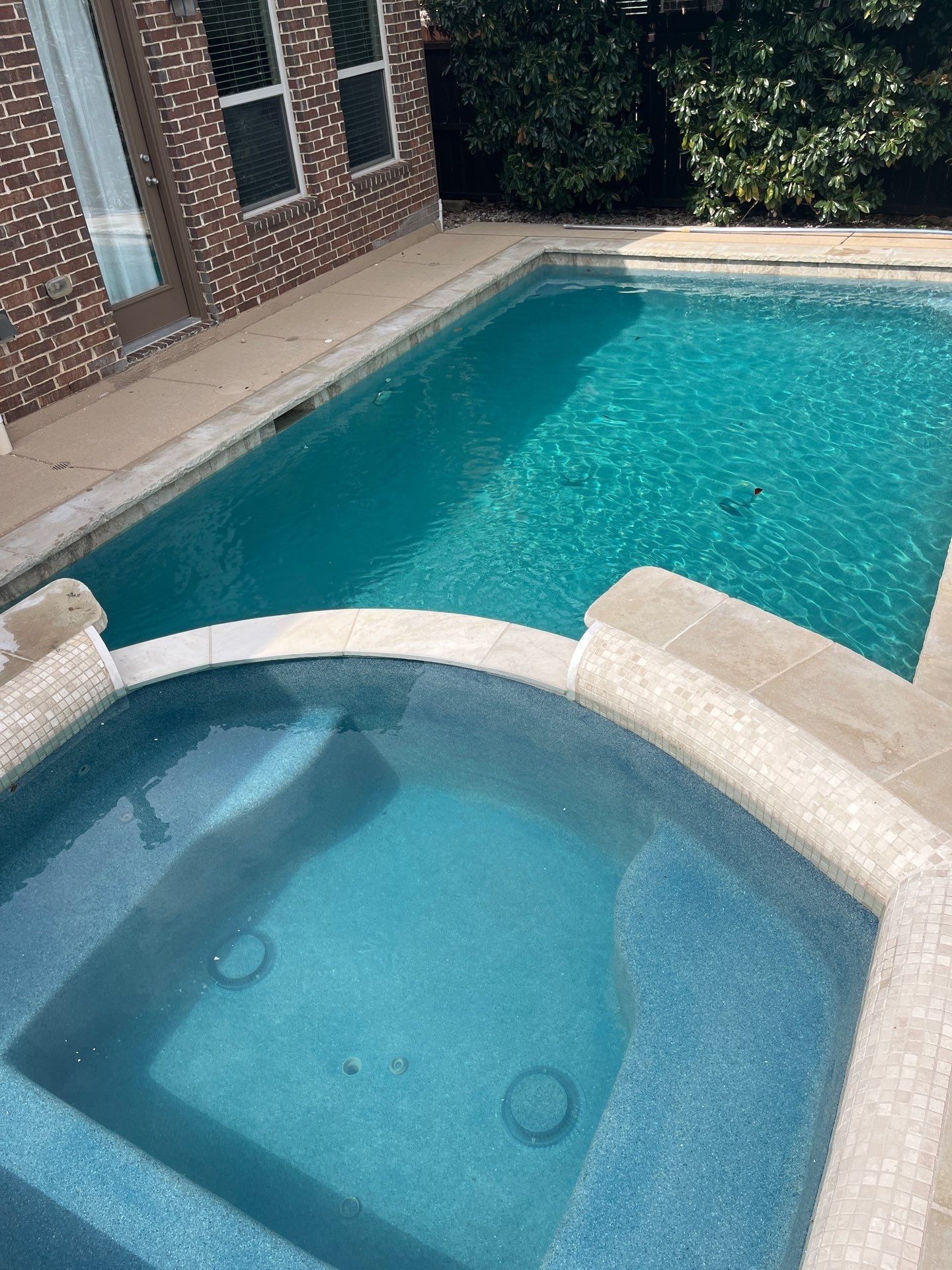 Geometric Pool Remodel with Raised Stone Spa by Pinnacle Pools and Spas - DFW