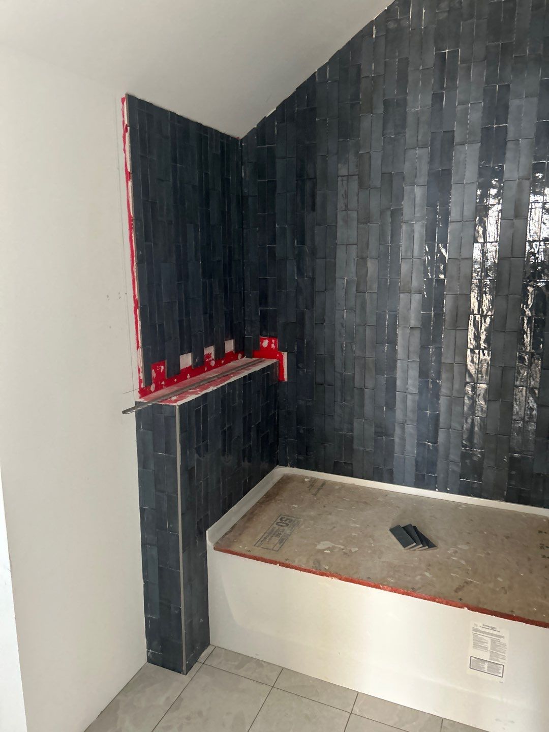 Tile floors, walls, showers, and accent wall for bathrooms  by Footprints Floors of Nashville