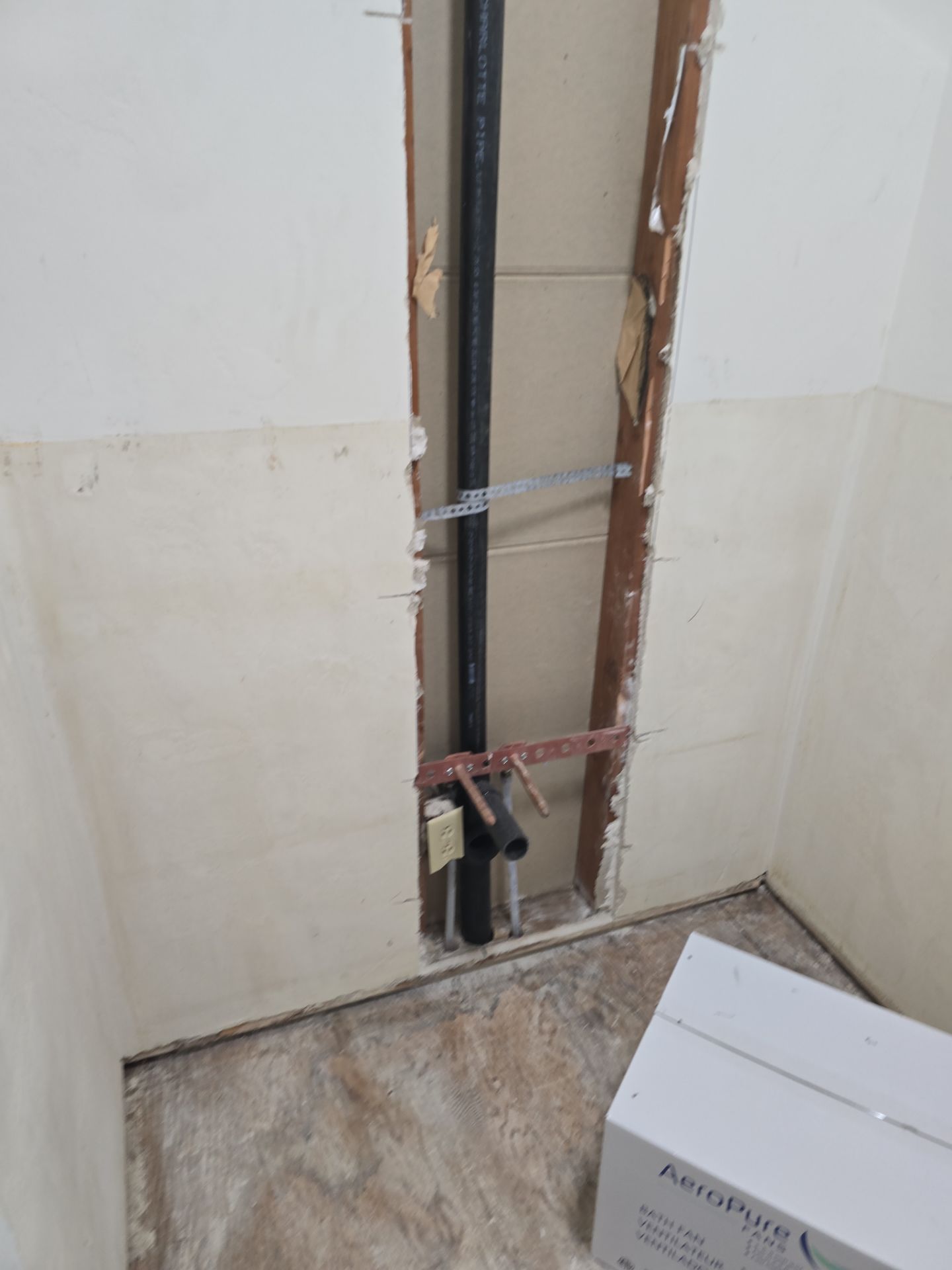 Installation of New Tall Black Piping (Wall to Ceiling) & Underground Piping by Us Plumbing