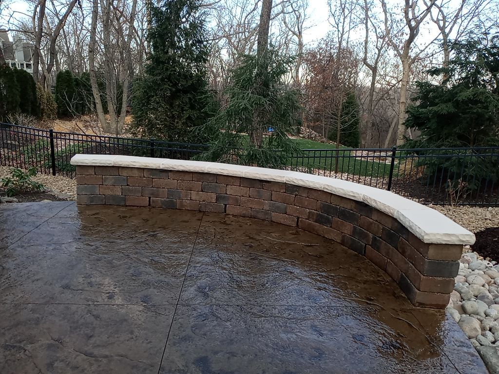 Back Yard Alpine Stamped Patio by LAND ESCAPES LLC