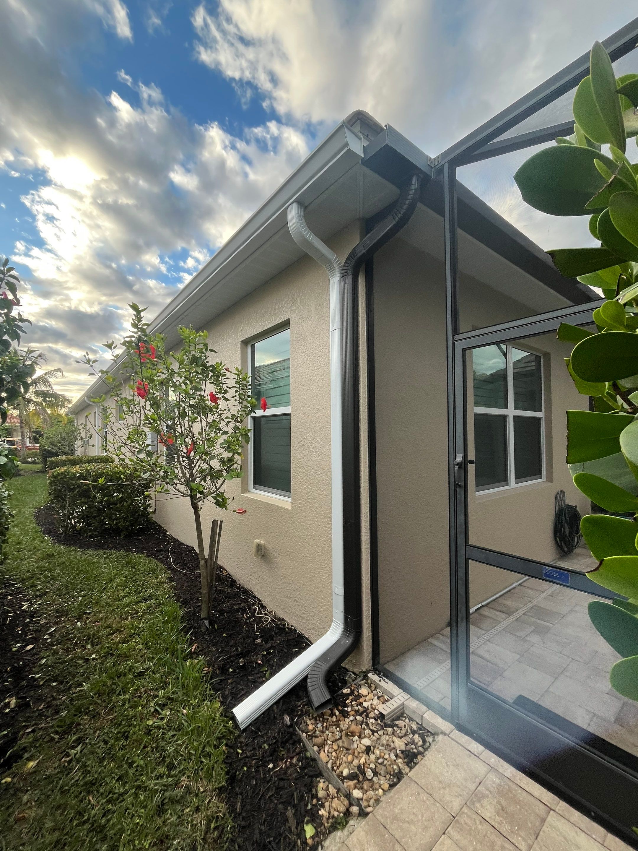 Downspouts using White Down Spouts in Fort Myers FL by Gutter Professors